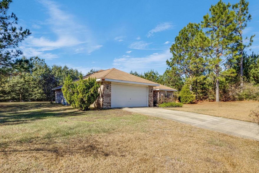 If you are looking for a quiet country setting don't let this one slip by.   This home boast an open floor plan, 4 bedrooms and 2 bathrooms with freshly painted interior rooms.  There is a huge great room that leads out to a large back yard.  Plenty of cabinets and counter space in the kitchen.  The master suite has a coffer ceiling, large master bath and walk in closet.  The Laundry room is inside and leads out to a two car garage. Schedule your showing today!