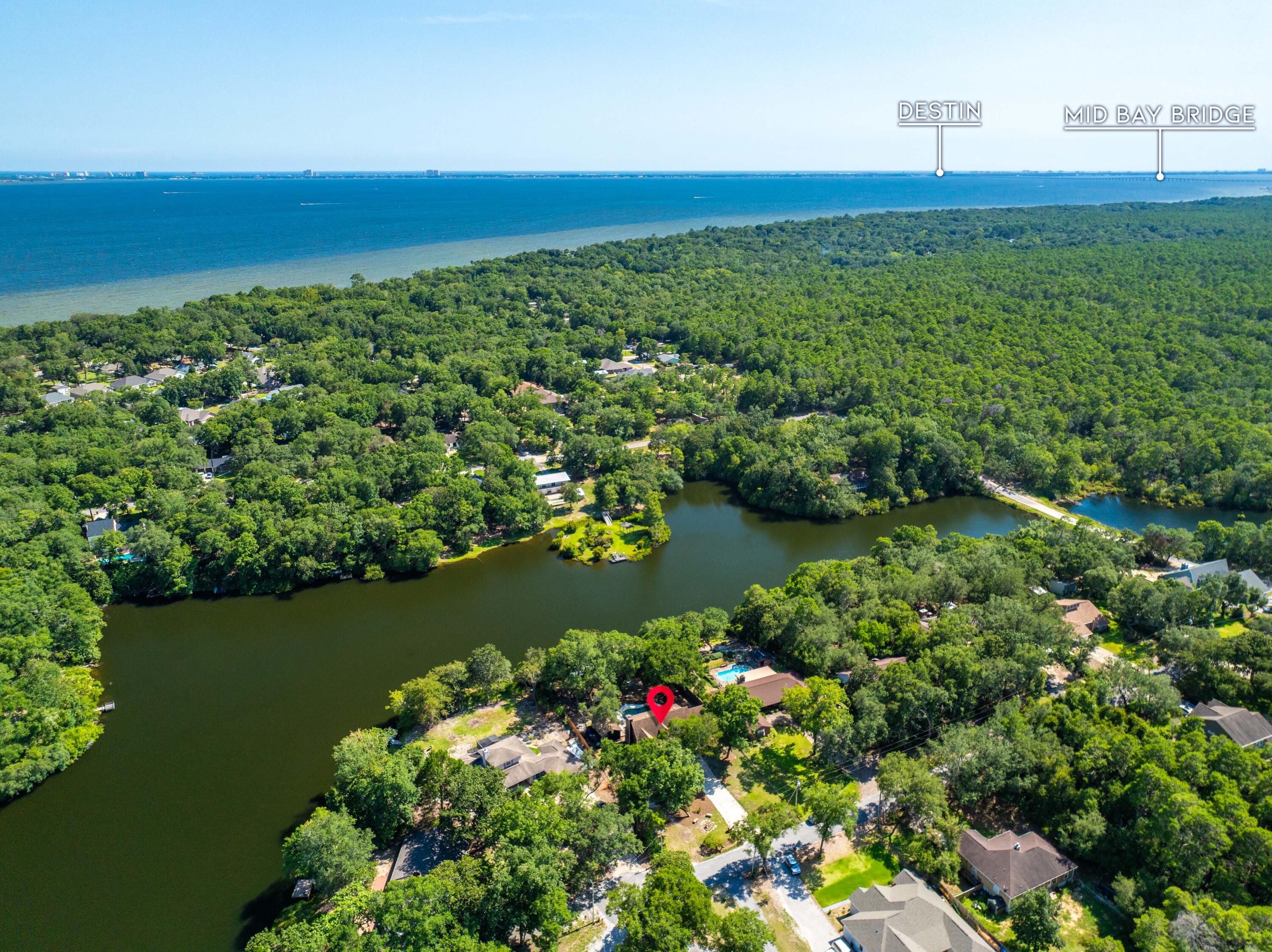 Tucked away in a quiet corner of Choctaw Beach, this private lakeside retreat is a dream come true for nature lovers and avid anglers alike. Welcome to 120 Darrell Court - a peaceful, two-story escape with stunning water views and a lifestyle built around relaxation, recreation, and privacy.The main home offers 3 spacious bedrooms and 3 full bathrooms, designed with both comfort and functionality in mind. Two upstairs bedrooms open directly onto a balcony overlooking the lake--the perfect spot to enjoy your morning coffee or unwind with a sunset view. Downstairs, a screened-in porch lets you take in the serene setting in comfort, while the attached two-car garage provides ample space for vehicles, gear, and storage.Step outside to your personal outdoor haven: a refreshing saltwater pool, perfect for cooling off after a day of fishing or boating. Just steps away, the guest house offers incredible flexibility ideal as an in-law suite, pool house, or private retreat for visiting friends and family.
Soak in the peaceful lake views from your newly built dock, perfect for morning reflections, sunset watching or casting a line. And for even more adventure, you're just minutes from Bay Front Park, featuring a free public boat launch serving as a gateway to the bay and gulf.
Whether you're casting a line in the nearby waters, enjoying the breeze from the back porch or balcony, or relaxing in your own poolside sanctuary, this property captures the best of Florida Panhandle living: peaceful, picturesque, and full of possibility.
Don't miss this rare opportunity to own a slice of secluded paradise.