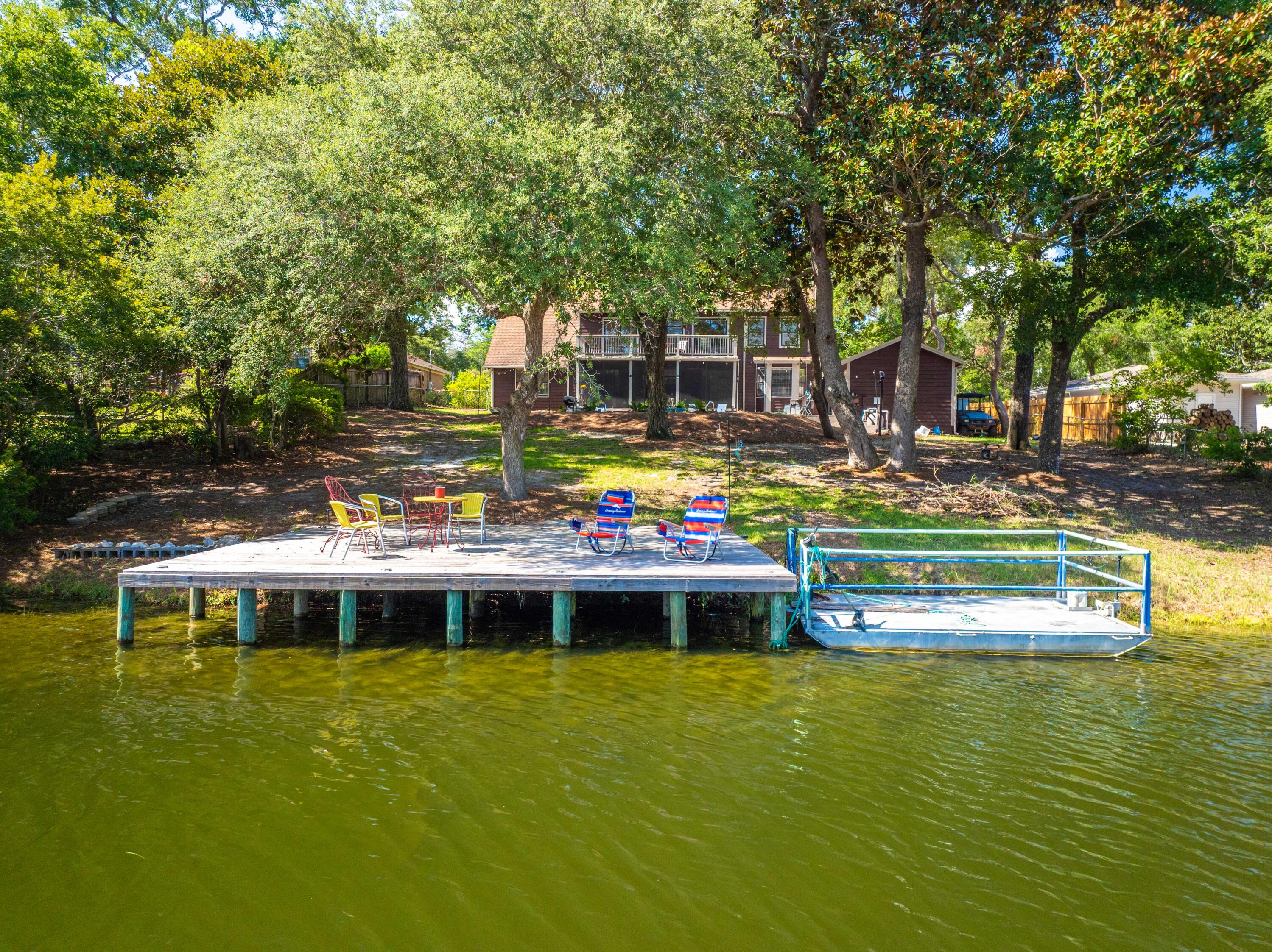 OPEN HOUSE AUG 16 11-2 PMTucked away in a quiet corner of Choctaw Beach, this private lakeside retreat is a dream come true for nature lovers and avid anglers alike. Welcome to 120 Darrell Court - a peaceful, two-story escape with stunning water views and a lifestyle built around relaxation, recreation, and privacy.The main home offers 3 spacious bedrooms and 3 full bathrooms, designed with both comfort and functionality in mind. Two upstairs bedrooms open directly onto a balcony overlooking the lake--the perfect spot to enjoy your morning coffee or unwind with a sunset view. Downstairs, a screened-in porch lets you take in the serene setting in comfort, while the attached two-car garage provides ample space for vehicles, gear, and storage. Step outside to your personal outdoor haven: a refreshing saltwater pool, perfect for cooling off after a day of fishing or boating. Just steps away, the guest house offers incredible flexibility ideal as an in-law suite, pool house, or private retreat for visiting friends and family.
Soak in the peaceful lake views from your newly built dock, perfect for morning reflections, sunset watching or casting a line. And for even more adventure, you're just minutes from Bay Front Park, featuring a free public boat launch serving as a gateway to the bay and gulf.
Whether you're casting a line in the nearby waters, enjoying the breeze from the back porch or balcony, or relaxing in your own poolside sanctuary, this property captures the best of Florida Panhandle living: peaceful, picturesque, and full of possibility.
Don't miss this rare opportunity to own a slice of secluded paradise.
Partial Owner Financing Available for Qualified Buyer