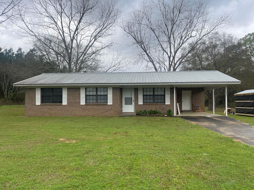 Enjoy the country life in this 3 bedroom, 1 bath brick home nestled on a huge lot in the Baker countryside. This home has a nicely sized living room, a nice kitchen with plenty of cabinet/counter space, refrigerator, and smooth cooktop stove/oven, and there's a formal dining room. Three bedrooms share one full bath. There is also a covered carport with a utility room complete with laundry hookups.  No smoking, including vapes.