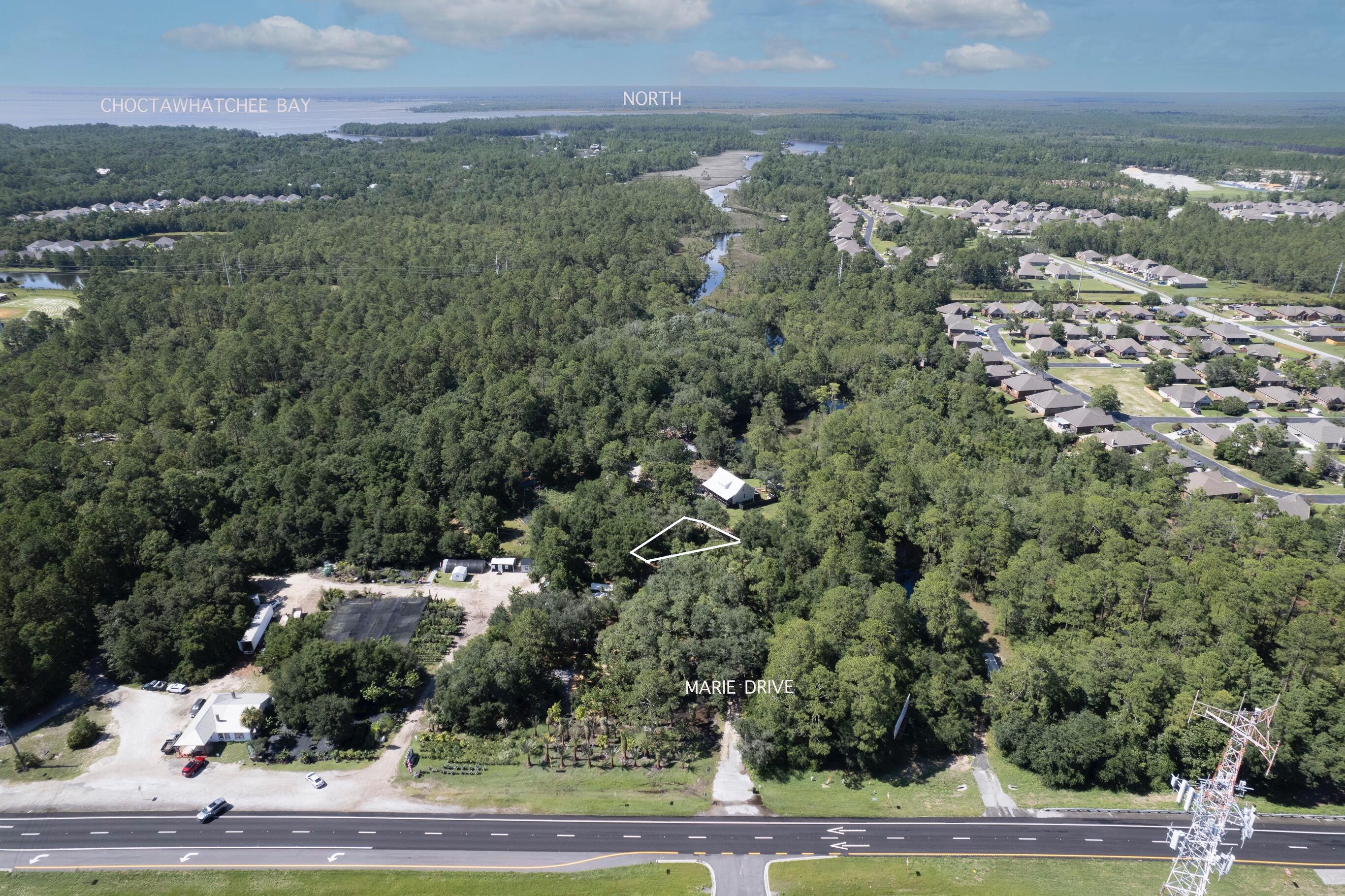 Great lot tucked away in Point Washington part of the quiet Peachtree Heights community. This property has No HOA with great potential to build a nice home or invest in. It is conveniently located just a few miles from places on 30A like Seagrove, Grayton Beach, or Seaside. It is also in close proximity to shopping, schools, and dining, as well as Point Washington Landing public boat ramp and Eden Gardens State Park.