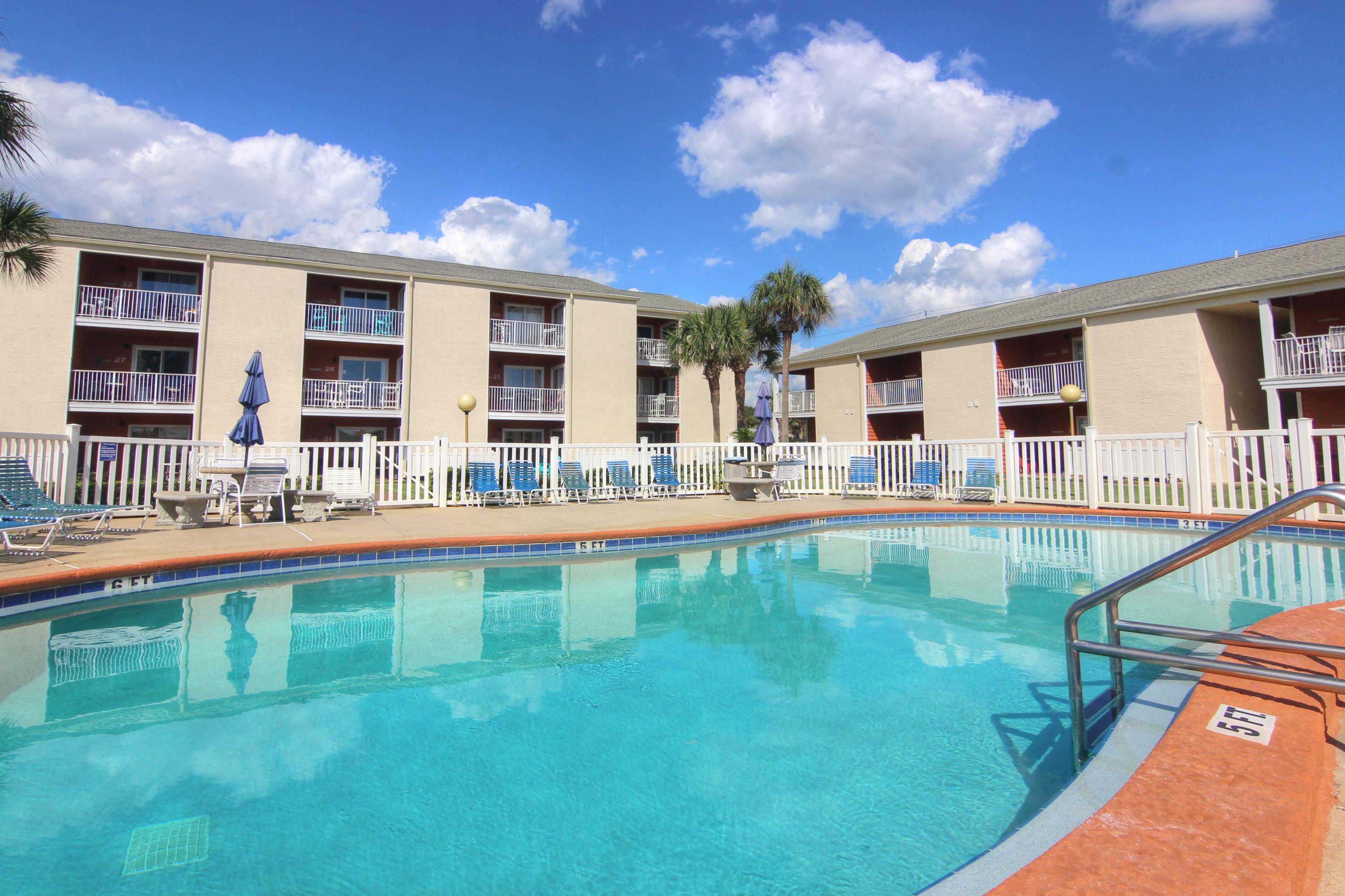 2 bedroom/2 bath ground floor condo... 80' from Pompano Joe's and the public beach access, walk off your patio across the huge manicured grass area and you are on the awesome White Sand Beach and Emerald Gulf Water. Renovated with granite counter tops in the kitchen, flat screen TVs throughout and a HVAC IN 2018. Plenty of room to sprawl and get comfortable. Sleeps 6...master BR has a King bed and private bath, 2nd BR has a queen with private bath. There is also a brand new queen sleeper sofa in the living room! . There is a stackable washer/dryer inside for convenience. Tradewinds is a low density complex with only 32 units, large pool, grill area and an assigned parking space for each unit (guest spots as well) Location is perfect!