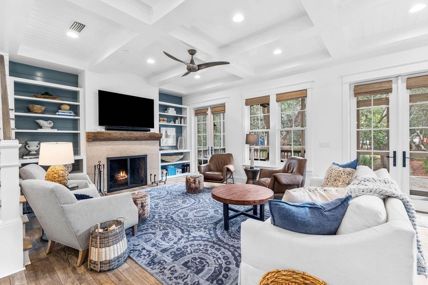This impressive beach house in Draper Lake Coastal Village enjoys breathtaking gulf views across the treetops from the top-floor balcony. The paver driveway leads up to a two-car garage and the entrance to this six-bed, five-bath home. The screened front porch is one of several outdoor living spaces. Offering a comfortable lifestyle, this spacious home is all about versatility. It's perfect for larger families and those who love to entertain. It boasts a one-bed carriage house with kitchenette and bathroom with its own independent access. The main house has myriad rooms and spaces that could efficiently be utilized as a bunk room, bonus room, second sitting room or home office. The grandeur of the living room immediately captures your attention, with a multitude of windows casting natural light across the generous space. The gourmet kitchen is fully equipped with a large island, quartz countertops, an impressive Thermador gas range, stainless appliances, beautiful lighting, pantry storage and tons of cabinetry beneath a lofty coffered ceiling. Real porcelain ceramic tile flooring and a sliding barn door add a touch of rustic charm. It flows naturally into a family dining area and a sitting room. Coastal decor complements the open fireplace, along with built-in shelving and a wet bar for entertaining. Doors open directly onto the screened porch. A spacious laundry room and a guest bathroom also occupy the first floor. The second floor has three bright bedrooms, with an additional bedroom on the third floor. The spacious master bedroom has its own generous balcony. It's the perfect place to start the day with a cup of coffee while listening to birds in the surrounding trees. The adjoining private bathroom has dual vanities, a walk-in shower, an oval soaking tub in the well-lit space. When it comes to recreational activities, it's hard to beat this coastal dune lake community. Fishing, hiking, kayaking and paddleboarding are on the doorstep and easy access to the beach and Draper Lake make swimming and sunbathing a breeze. Two boat houses, a lookout tower, two community pools and more are part of this gated community lifestyle, with 30A shopping and dining nearby.