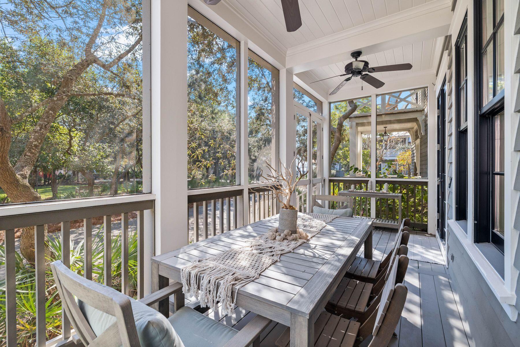 This impressive beach house in Draper Lake Coastal Village enjoys breathtaking gulf views across the treetops from the top-floor balcony. The paver driveway leads up to a two-car garage and the entrance to this six-bed, five-bath home. The screened front porch is one of several outdoor living spaces. Offering a comfortable lifestyle, this spacious home is all about versatility. It's perfect for larger families and those who love to entertain. It boasts a one-bed carriage house with kitchenette and bathroom with its own independent access. The main house has myriad rooms and spaces that could efficiently be utilized as a bunk room, bonus room, second sitting room or home office. The grandeur of the living room immediately captures your attention, with a multitude of windows casting natural light across the generous space. The gourmet kitchen is fully equipped with a large island, quartz countertops, an impressive Thermador gas range, stainless appliances, beautiful lighting, pantry storage and tons of cabinetry beneath a lofty coffered ceiling. Real porcelain ceramic tile flooring and a sliding barn door add a touch of rustic charm. It flows naturally into a family dining area and a sitting room. Coastal decor complements the open fireplace, along with built-in shelving and a wet bar for entertaining. Doors open directly onto the screened porch. A spacious laundry room and a guest bathroom also occupy the first floor. The second floor has three bright bedrooms, with an additional bedroom on the third floor. The spacious master bedroom has its own generous balcony. It's the perfect place to start the day with a cup of coffee while listening to birds in the surrounding trees. The adjoining private bathroom has dual vanities, a walk-in shower, an oval soaking tub in the well-lit space. When it comes to recreational activities, it's hard to beat this coastal dune lake community. Fishing, hiking, kayaking and paddleboarding are on the doorstep and easy access to the beach and Draper Lake make swimming and sunbathing a breeze. Two boat houses, a lookout tower, two community pools and more are part of this gated community lifestyle, with 30A shopping and dining nearby.