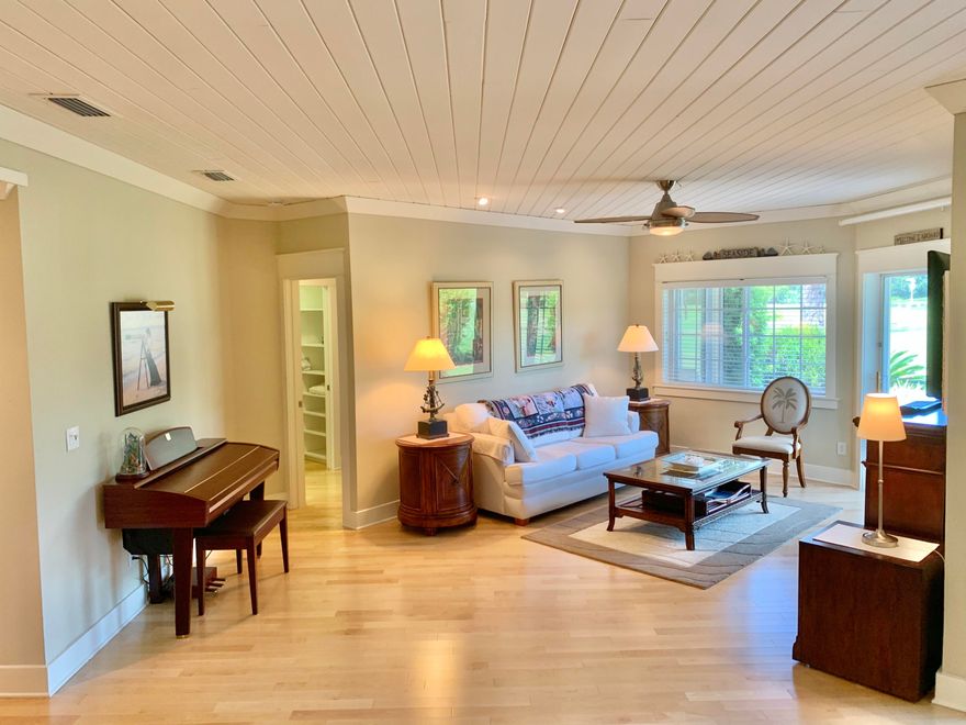 This beautiful 2 bedroom villa is a perfect vacation rental or 2nd home.  It's location is walking distance to the beach and just a tram ride to the village for night life, restaurant, golf, tennis, shopping and the Marina. NOTE: It also has a dedicated golf cart parking spot that conveys with the condo. The piano and some artwork does NOT convey.
You can sit on your screen porch and watch the golfers and see the sunset too.  It has been completely updated in the last 4 years and is move in ready.  Showing is easy as it is vacant.  Please call to set an appointment as this villa will not last long.