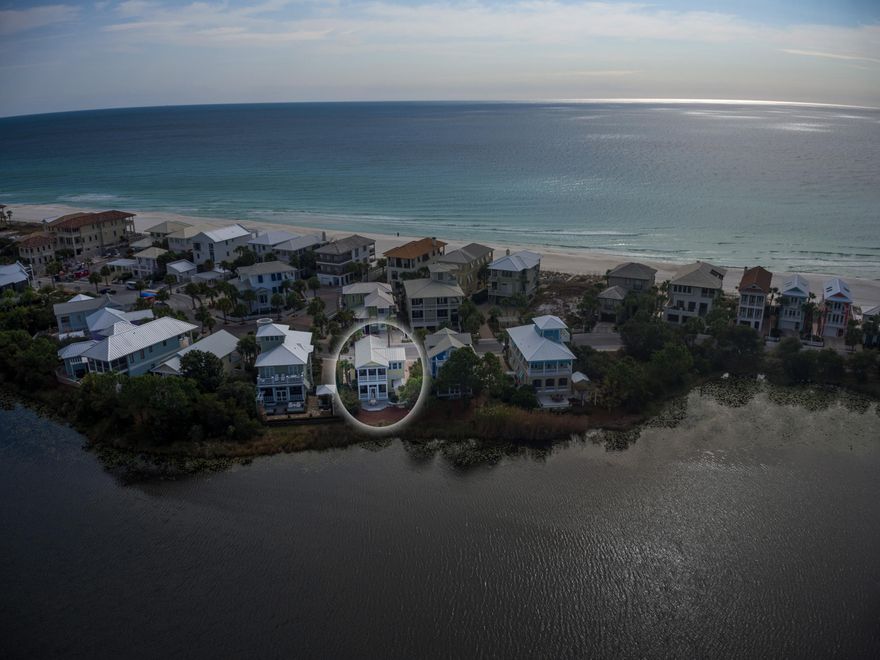 Located in the center of Carillon Beach, ON Lake Carillon and just ONE HOME OFF THE GULF! This custom built 3bed/4ba 1787sq.ft. beach house is perfectly perched on Lake Carillon, a tranquil 13-acre lake JUST STEPS FROM THE GULF that lights up beautifully at night with lights from the dreamy downtown market. The 2nd floor Master Bedroom is filled w/ natural light & overlooks the lake w/ PRIVATE SCREENED IN BALCONY perfect for relaxing, reading a book, or just taking in the scenery. The 2nd floor is also home to the guest bedrooms. One, a lakefront SECOND MASTER SUITE & the other, a picturesque CUSTOM BUNK ROOM w/ Gulf views. Descend the hardwood stairs to the 1st floor to find the OPEN CONCEPT living, dining, kitchen area w/ HARDWOOD FLOORS THROUGHOUT. The kitchen w/ STAINLESS appliances