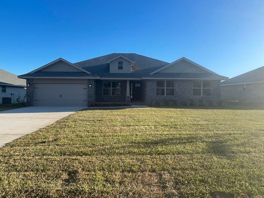 Need a 3 car garage? Look no further! This plan has that and so much more! Upgraded flooring throughout with carpet only in bedrooms. Granite throughout with cape cod style all wood cabinetry. The master bath has been upgraded with a separate shower and garden tub. THis floor plan is wide open with carefully chose colors. The covered lanai can be accessed  by way of the family room, master bedroom and 3rd bathroom. Bedroom number 2 is off by itself with its' own bathroom. The kitchen has a breakfast nook and breakfast bar. For formal eating there is a separate dining room. This home is all electric and comes with microwave, self cleaning smooth top range, and dishwasher all stainless steel.The exterior is 4 sided brick and sprinklers are standard.