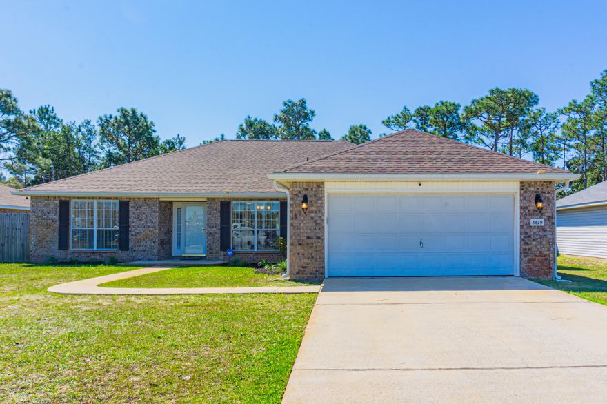 This IMMACULATELY maintained home is waiting for you to Move Right In! Everything has been done to make this property Sparkle. ALL NEW Interior Paint to include Doors (inside and out!) baseboards, walls and even the garage. Carpets (Bedrooms only!) have been professionally cleaned.  The low maintenance landscaping refreshed. You enter into the appointed Foyer with a sun lit Dining Room to your right. The Living Room is Huge and allows views to the Gorgeous Backyard with Pergola Covered Patio. Breakfast Bar. Massive Kitchen with loads of Counter Space and Cabinets along with a Window Graced Eat-In Area. Large Owners Suite with His & Hers Closets, Soaker Tub and Separate Shower. . Please Read 'More' Inside Laundry with additional Pantry ShelvingSplit Bedrooms with Bath are located on the west side of the home. You can sit on the freshly power washed driveway and watch the Navarre High School Sports!
SO very convenient to Shopping, Restaurants and the Beautiful Navarre Beach. Straight shot north on Hwy 87 to the Interstate! Less than 11 miles to Hurlburt Field! 
PER THE SELLER:
Roof Nov 2020
HVAC Mar 2016
Water Heater Apr 2021
Reverse Osmosis Water Filtration System
New Pump for Lawn Irrigation System
Front & Back Security Cameras Left for the New Owners
Pergola over Back Patio recently refurbished by Reef Runners
Transferrable Termite Bond in place