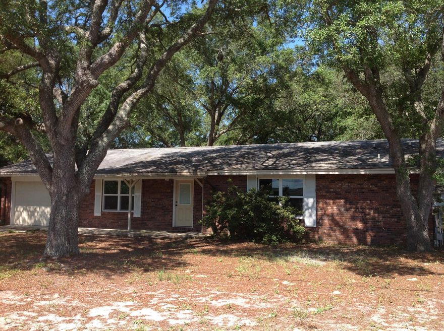 LAST CHANCE TO PURCHASE THIS HOME BEFORE IT GOES TO THE RENTAL MARKET. PRICE HAS BEEN REDUCED FOR QUICK SALE. MAKE AN OFFER! ANY AND ALL OFFERS WILL BE CONSIDERED! Check out this Great Opportunity to own a home in a part of the county with a high elevation. Features include: Dimensional Shingles, New Hurricane Windows all around, 3 new outside doors. Front, Rear Sliding, Rear Garage. New Water heater installed in 2013. Brick exterior/low maintenance. This centrally located home has easy access to shopping, Hulbert, and Eglin AF base. This is a wonderful home for first time buyers or a Great investment opportunity. Seller is motivated. Make an Offer! ''AS IS'' Sale.