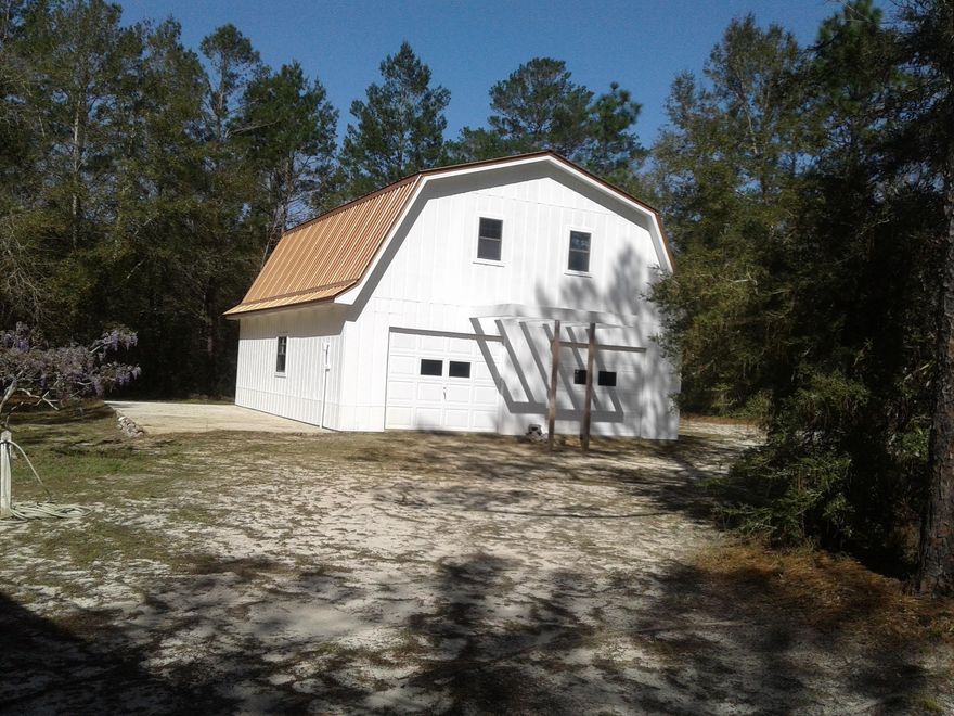 This beautiful property sits on 4.76 acres, full of charm and beauty with a large 2 story Barn with power  which doubles as a 2 car garage, also a workshop, and a SPRING across the back of the property not far from the home itself. The home is super cute with an open floor plan and a deck to sit out and enjoy the breeze with your morning coffee.Appliances and most of the furniture will stay with the home. Washer/dryer hookup located in the workshop but can move it into the home.  The Barn has power! Upstairs  has 2 windows and can turn the space into a  bedroom or living  space.  First floor is for the cars, toys, and boasts plenty of storage. You can add a bathroom easy to make this another livable space.  Hvac 5 years old, seller to put on a new metal roof. Close to bases & beaches.