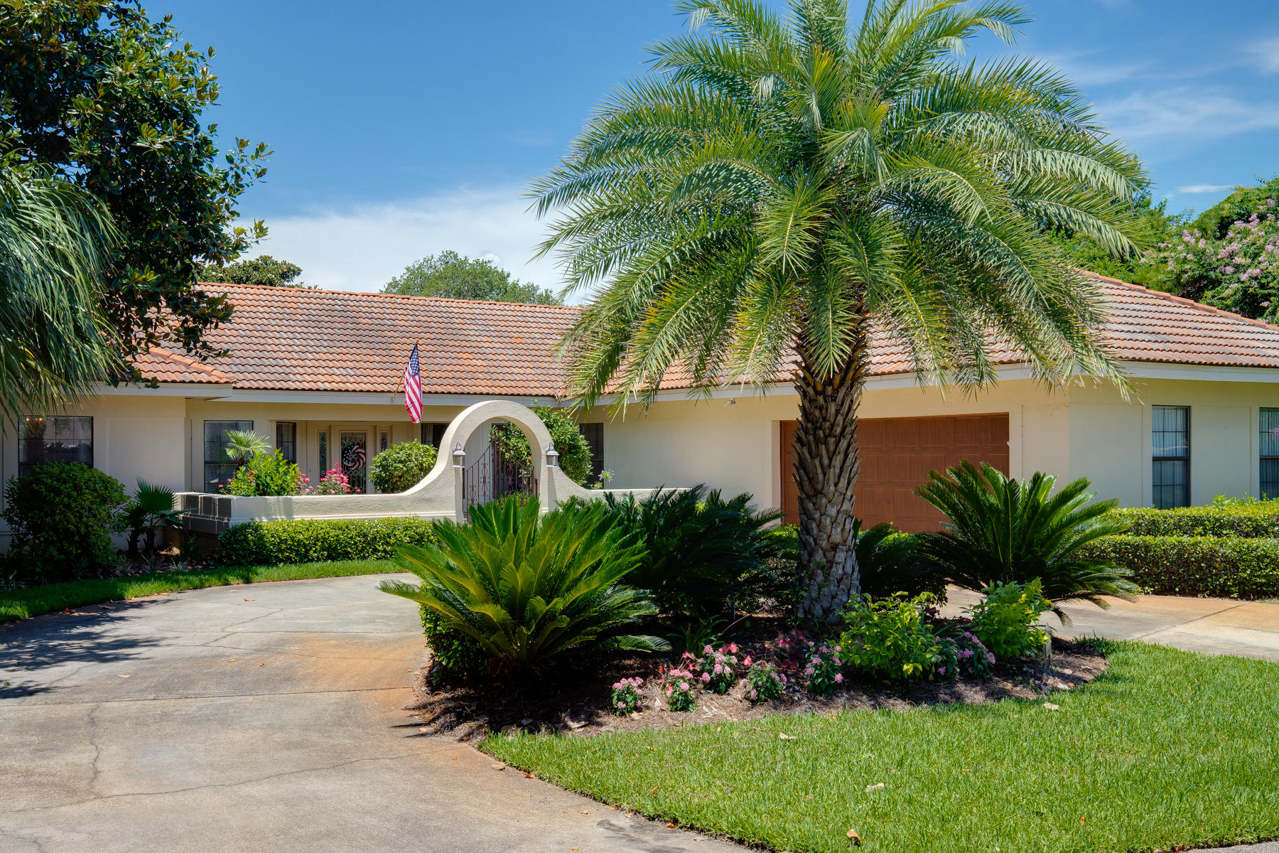 Love to entertain? This golf course estate has all the space you need for friends & family! Gather around the huge eat-in kitchen or 2 dining areas adjacent to the kitchen, or enjoy the outdoor scenery from the screened porch. The kitchen has been completely remodeled with resurfaced white cabinets, 12' custom Costa Emeralda granite island, new stainless GE Monogram refrigerator, double convection ovens, 5 burner induction cooktop & dishwasher. The master retreat offers a raised ceiling, screened porch access, his & her closets, double vessel sinks, jetted tub with separate shower and beautifully tiled back splash and mirror accents. Every room is uniquely designed with coastal accents blended with a French provincial style, tile flooring throughout, and crown molding.