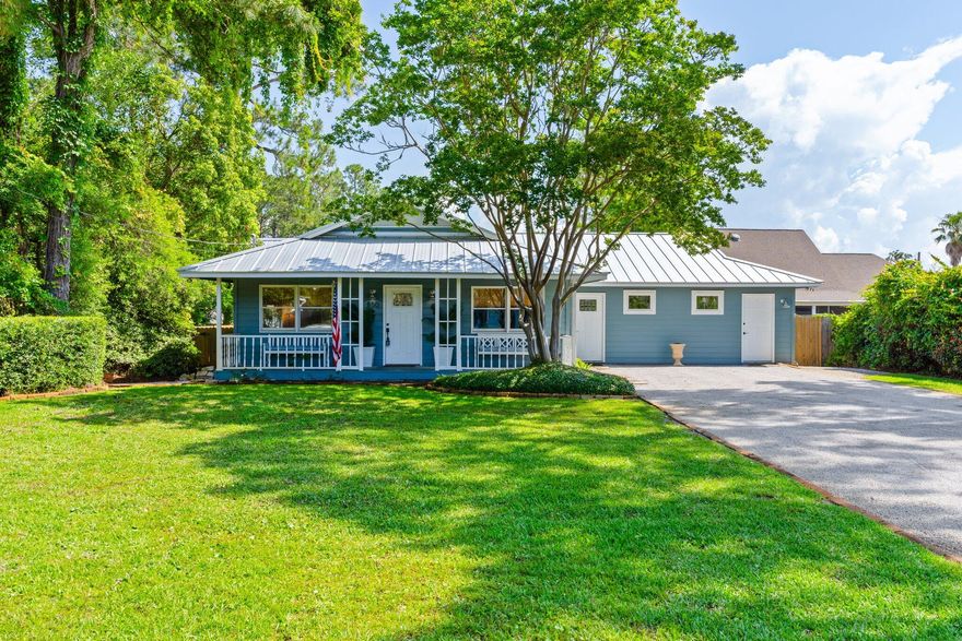 Renovated Blue Beach Cottage w/ private Pool, Bay Access & Ideal Location! This adorable cottage offers the perfect blend of charm, comfort, & convenience--all just a 5-min golf cart ride to the beach and mere steps to the bay, where you can easily launch your boat, kayaks, or paddleboards! Nestled in a quiet, friendly neighborhood, this home boasts an oversized driveway--perfect for guests or storing your boat. The spacious backyard has a gorgeous heated salt water gunite pool, ideal for relaxing after a day in the sun. Unwind in the expansive screened-in porch, perfect for enjoying warm coastal evenings.  Inside, you'll find tasteful updates throughout, preserving the cottage's cozy character while offering modern comforts. 2023 Aetric golf cart included! New metal roof in 2022! NO HOA.
