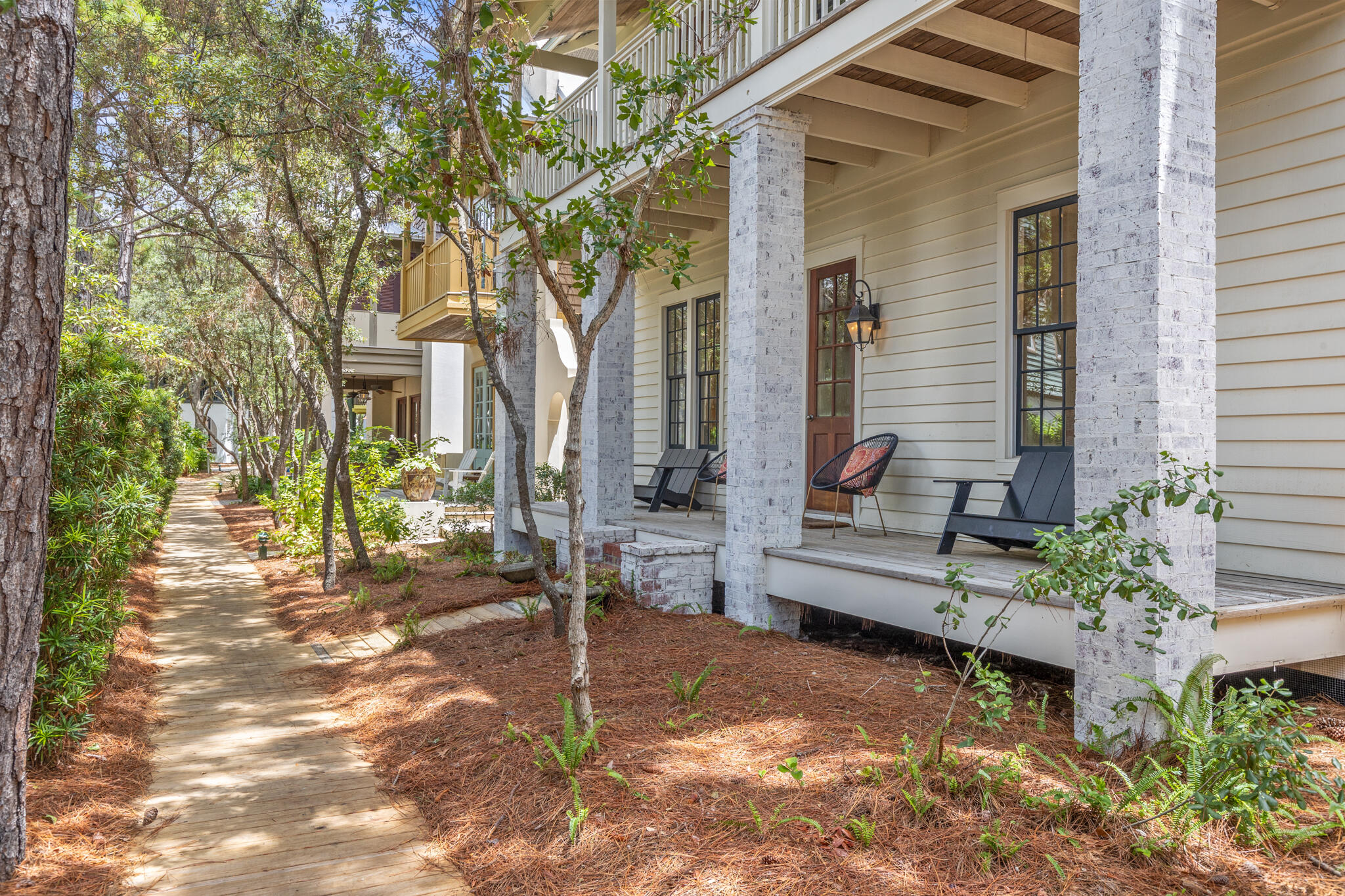 This exquisitely charming cottage nestled in the idyllic and highly desirable Coastal Community of Rosemary Beach offers 3 bedrooms and 3 baths and two separate living areas. This lovely property is situated on a tree-lined Boardwalk , mere steps from the vibrant town center and just minutes to the pristine beach. The French door courtyard entryway invites you into a tranquil haven, adorned with soothing earth tones and beautiful oak floors. The comfortable seating area is perfect for unwinding after a day of enjoying the beach.This delightful parkside cottage boasts a chef-style kitchen, thoughtfully designed with ample pantry storage, island seating for four, and a spacious dining area, all seamlessly integrated into the open floor plan. The first floor also features an additional