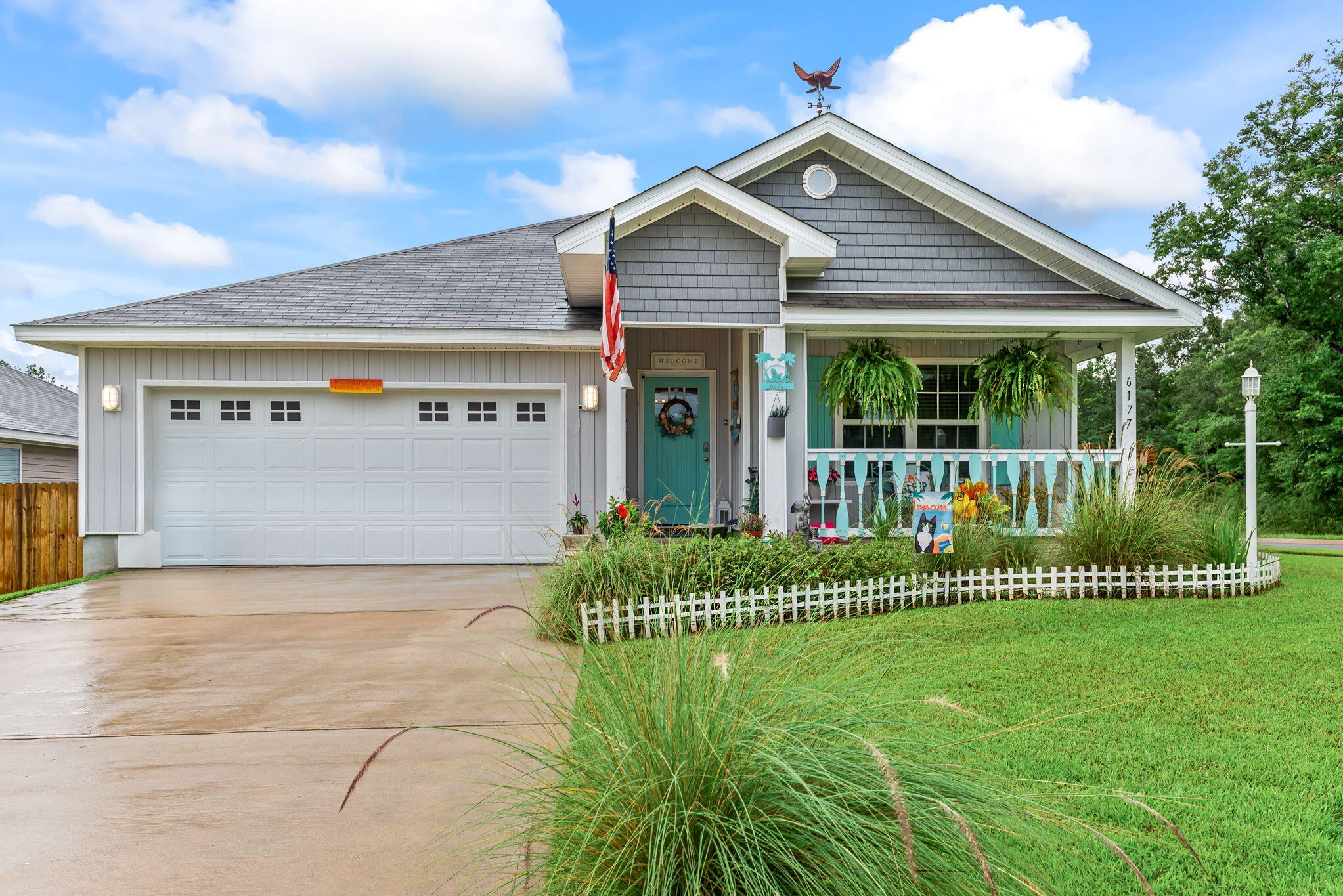 You are going to fall in love with this charming beach style cottage and it is just two years young! There are so many recent upgrades that have been done to make this home truly a one-of-a-kind custom Florida themed home! There is a welcoming entryway into the home and the four bedrooms are arranged in a split plan with the private master suite located in the back of the home. The kitchen is open to the living and dining area, with beautiful enhancements throughout including: light fixtures, ceiling fans, a glass pantry door, mosaic tile backsplash, quartz countertops, deep stainless steel kitchen sink, brushed nickel kitchen faucet, cabinet door hardware and new interior doors. The bathrooms have also been upgraded with new light fixtures, quartz countertops, and cabinet hardware. Exterior enhancements include a covered front porch with a wood custom railing, wood custom shutters, front entry door, cedar shaker style vinyl siding, a screened-in back patio, exterior light fixtures, double-sided shadow box privacy fence and landscaping. The kitchen appliances, washer, dryer, camera security system, termite warranty, and upgrades are included for the new owners to enjoy!