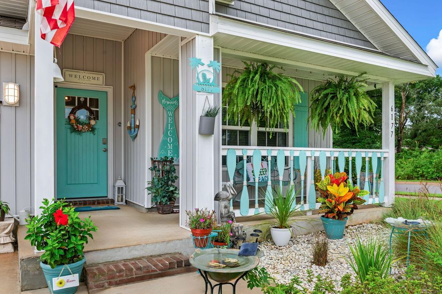 You are going to fall in LOVE with this CHARMING beach style cottage and it is just 2 YEARS young! There are so many recent UPGRADES that have been done to make this home truly a ONE-OF-A-KIND custom Florida themed home! There is a WELCOMING entryway into the home and the four bedrooms are arranged in a split plan with the PRIVATE master suite located in the back of the home. The kitchen is OPEN to the living and dining area, with beautiful ENHANCEMENTS throughout INCL: light fixtures, ceiling FANS, a GLASS pantry door, mosaic TILE backsplash, QUARTZ countertops, DEEP stainless steel kitchen sink, brushed nickel kitchen faucet, cabinet door HARDWARE and NEW interior doors. The bathrooms have also been UPGRADED with new light fixtures, quartz countertops, and cabinet hardware! Exterior enhancements include a covered front porch with a wood custom railing, wood custom shutters, front entry door, cedar shaker style vinyl siding, a screened-in back patio, exterior light fixtures, double-sided shadow box privacy fence, weathervane  and landscaping. The kitchen appliances, washer, dryer, camera security system, termite warranty, and upgrades are included for the new owners to enjoy!