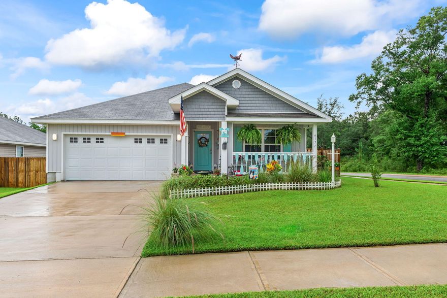 You are going to fall in love with this CHARMING beach style cottage and it is just 2 YEARS young! There are so many recent UPGRADES that have been done to make this home truly a ONE-OF-A-KIND custom Florida themed home! There is a WELCOMING entryway into the home and the four bedrooms are arranged in a split plan with the PRIVATE master suite located in the back of the home. The kitchen is OPEN to the living and dining area, with beautiful ENHANCEMENTS throughout INCL: light fixtures, ceiling FANS, a GLASS pantry door, mosaic TILE backsplash, QUARTZ countertops, DEEP stainless steel kitchen sink, brushed nickel kitchen faucet, cabinet door HARDWARE and NEW interior doors. The bathrooms have also been UPGRADED with new light fixtures, quartz countertops, and cabinet hardware! Exterior enhancements include a covered front porch with a wood custom railing, wood custom shutters, front entry door, cedar shaker style vinyl siding, a screened-in back patio, exterior light fixtures, double-sided shadow box privacy fence, weathervane  and landscaping. The kitchen appliances, washer, dryer, camera security system, termite warranty, and upgrades are included for the new owners to enjoy!