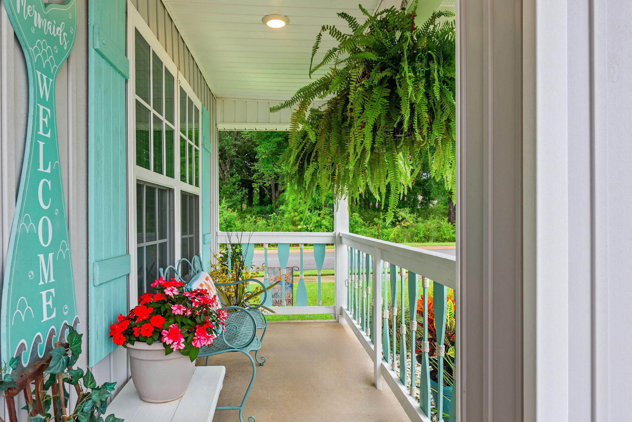 You are going to fall in love with this CHARMING beach style cottage and it is just 2 YEARS young! There are so many recent UPGRADES that have been done to make this home truly a ONE-OF-A-KIND custom Florida themed home! There is a WELCOMING entryway into the home and the four bedrooms are arranged in a split plan with the PRIVATE master suite located in the back of the home. The kitchen is OPEN to the living and dining area, with beautiful ENHANCEMENTS throughout INCL: light fixtures, ceiling FANS, a GLASS pantry door, mosaic TILE backsplash, QUARTZ countertops, DEEP stainless steel kitchen sink, brushed nickel kitchen faucet, cabinet door HARDWARE and NEW interior doors. The bathrooms have also been UPGRADED with new light fixtures, quartz countertops, and cabinet hardware! Exterior enhancements include a covered front porch with a wood custom railing, wood custom shutters, front entry door, cedar shaker style vinyl siding, a screened-in back patio, exterior light fixtures, double-sided shadow box privacy fence, weathervane and landscaping. The kitchen appliances, washer, dryer, camera security system, termite warranty, and upgrades are included for the new owners to enjoy!