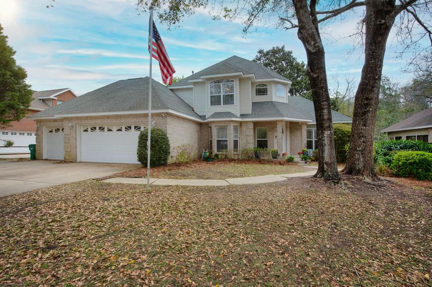 SELLER WILL CONTRIBUTE UP TO $5500 IN SELLER CONCESSIONS!!! Roof 2017, Dual zone HVAC with smart thermostat 2017, gas WH 2022, hard-wired WHOLE HOUSE GENERATOR.. Don't miss your opportunity to own this beautifully remodeled (2019) mostly brick, 3-car garage home. There is wood-like tile throughout the downstairs, recessed lighting, fans in all the rooms. There is a HUGE formal dining room AND eat-in kitchen.  The chef in your life will LOVE the abundance of beautiful granite counter tops, newer soft-close cabinets, two FULL-SIZE wall ovens, a prep sink in the island with garbage disposal, gas stove, an oscillating overhead fan, brick-like backsplash. The view out the kitchen bay window and screened in back porch look out to the woods of the Eglin AFB Reservation. You get beautiful views of native plants, flowers, and wildlife. The spacious screened-in porch has tile flooring and is a great space to sit and enjoy the serene views bug free and with the breeze of the outdoor fans!  Its also a great space for entertaining and grilling out; complete with gas hook up. There is an awesome doggie door through the deck with brand new steps. The master bedroom is on the first floor and features trey ceilings, sliding glass doors to the Florida room (that is like a wall of windows with views of the Reservations, too!) The master bath boasts dual sink vanity with quartz countertops, soaking tub, walk-in shower with tile surround, 2 shower head one that is similar to a rainwater shower, large walk-in closet with custom built-in organizers.  Other great features:  central vacuum, outdoor stone fire pit, perfect for warming up on chilly nights, all bathrooms have quartz counters and new cabinetry, the 1/2 bath downstairs has a beautiful barn door.  There is an abundance of storage. The laundry room has granite counters and additional cabinets. Garage has cabinets and utility sink, the shelves in the garage will convey.