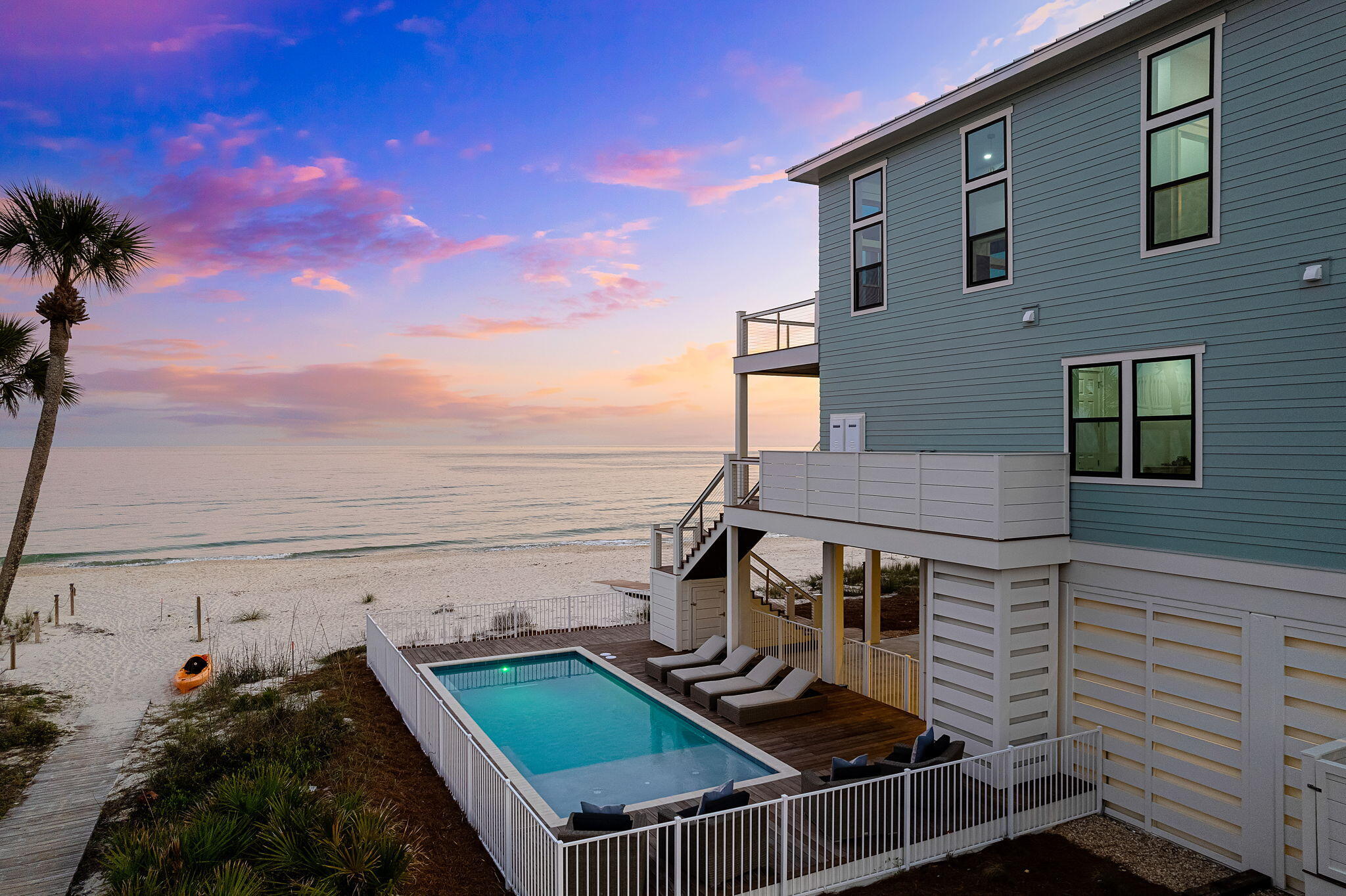 Spectacular custom Gulf front home in the Plantation on St. George Island completed 2023 with 112' of beachfront. No detail overlooked for this 3,479 sq ft, 6 Bedroom, 6.5 Bath Gulf front home with heated pool and Gulf views forever. Chef kitchen, top of the line appliances, elevator to all floors, stunning tile bathrooms and LVP flooring throughout. Be a part of the exclusive private gated neighborhood of The Plantation. The Plantation amenities consist of Clubhouse, tennis courts, nature trails, bike paths, private landing strip all on the western side of the island.