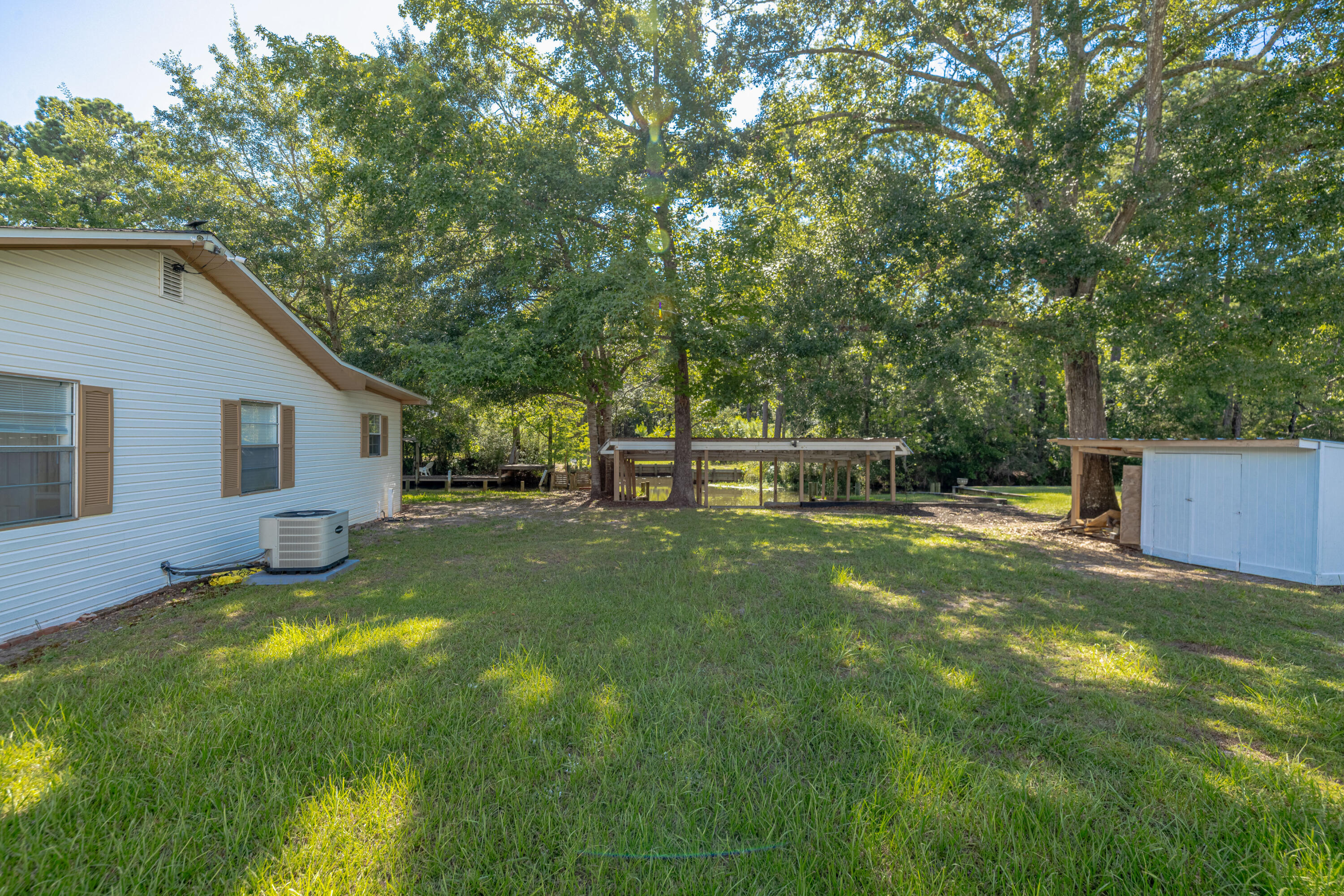 Waterfront Living at Its Finest! Nestled in Bunker Creek, this Southern-style retreat sits on .21 acres with 125 feet of waterfront along a 20' wide, 4' deep canal. Enjoy boating and fishing with 3 covered boat slips, a sea wall, and quick access to Choctawhatchee Bay, the intracoastal, and Crab Island. Inside, the 2BR/2BA layout features a bright kitchen, cozy fireplace room, and screened porch perfect for sunsets. Whether a full-time home or weekend getaway, this peaceful slice of paradise blends comfort, charm, and outdoor adventure. The river and bay are calling--don't miss it!