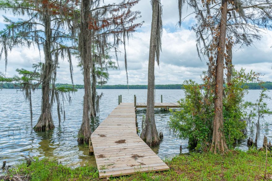 Located on the Shores of BEAUTIFUL Lake Jackson in Florala, Alabama - this lot offers you 96 feet on the water that is absolutely breathtaking! This gorgeous lot sits behind a gated community with tons of privacy! If you have been dreaming of ever owning on Lake Jackson -this is your lot! Property on desired Lake Jackson is sparce and has few opportunities to purchase. Lot is level and cleared with remaining trees left for a perfect lake yard! Lot has underground utilities available. Lake Jackson offers fishing, boating and water skiing. Sit on your brand-new built dock and enjoy afternoons of endless relaxation! HERE is where you want to build your forever dream home!!!