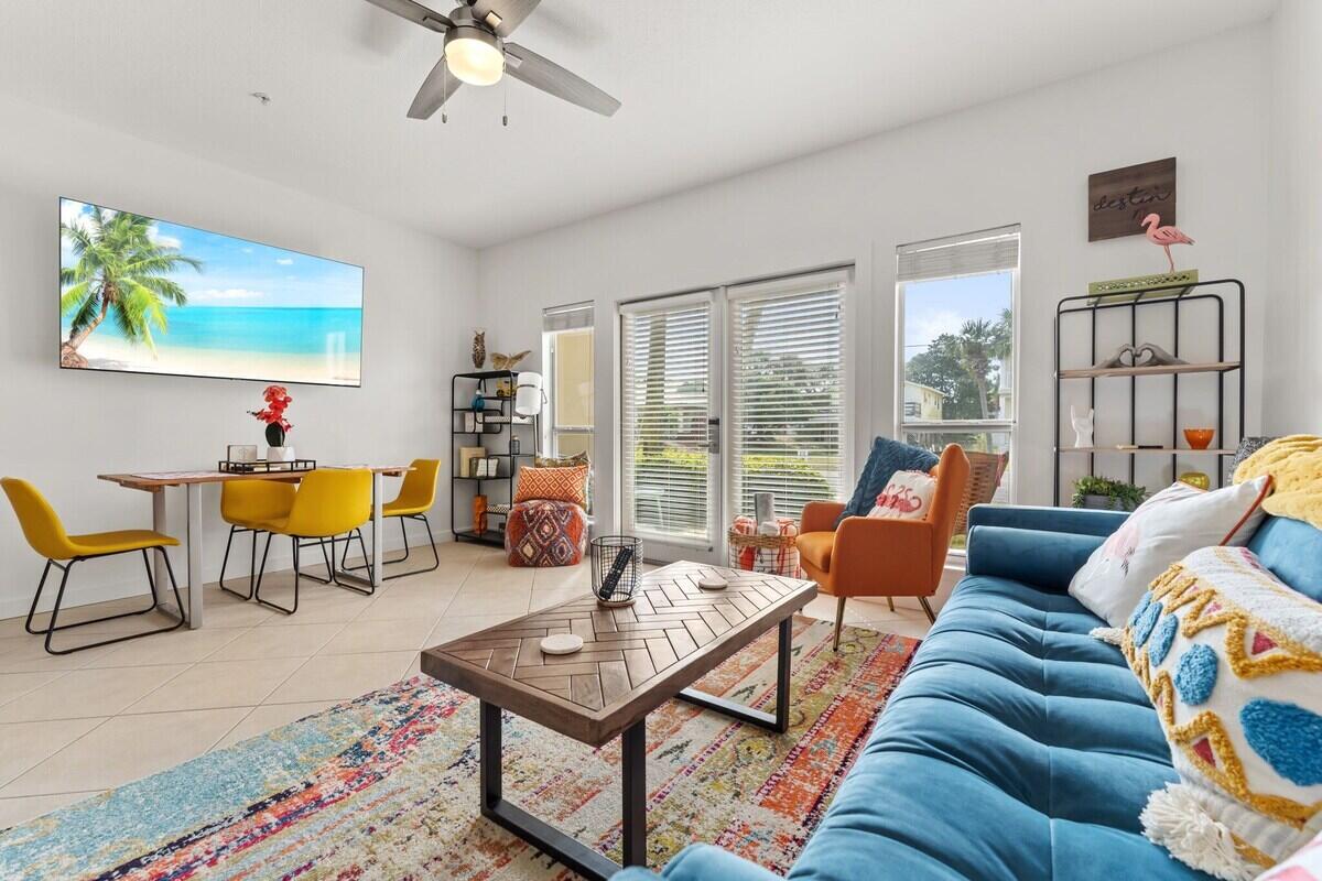 Step into laid-back coastal living at this ground-floor Caribbean Dunes residence, where boho beach style meets everyday comfort. Just a short stroll from the white sands of Crystal Beach, this one-bedroom, one-bath condo makes an ideal primary home, vacation retreat, or rental investment. Inside, the stylishly updated interior showcases a remodeled kitchen and bathroom, new flooring, and stainless steel appliances. The open living and dining area flows seamlessly to a large patio framed by lush landscaping, creating an inviting extension of your living space. Designed to sleep six, the condo includes cozy hallway bunks and a living room sleeper sofa, ensuring plenty of room for family and guests. Caribbean Dunes offers an array of amenities, including a sparkling pool and hot tub, walking and bike paths, and deeded beach access directly across the street. With favorite local restaurants like Camille's and charming shops within walking distance, this property places you in the heart of the Crystal Beach lifestyle.