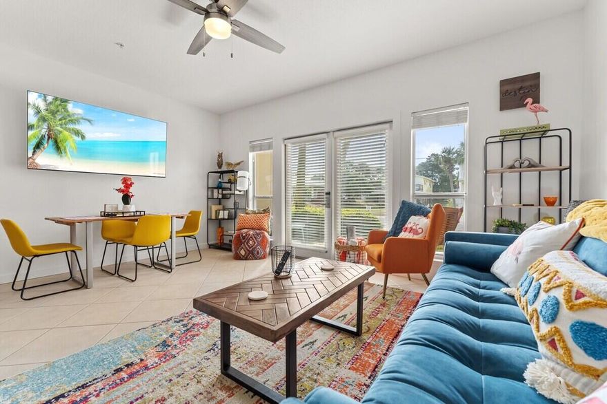 Step into laid-back coastal living at this ground-floor Caribbean Dunes residence, where boho beach style meets everyday comfort. Just a short stroll from the white sands of Crystal Beach, this one-bedroom, one-bath condo makes an ideal primary home, vacation retreat, or rental investment. Inside, the stylishly updated interior showcases a remodeled kitchen and bathroom, new flooring, and stainless steel appliances. The open living and dining area flows seamlessly to a large patio framed by lush landscaping, creating an inviting extension of your living space. Designed to sleep six, the condo includes cozy hallway bunks and a living room sleeper sofa, ensuring plenty of room for family and guests. Caribbean Dunes offers an array of amenities, including a sparkling pool and hot tub, walking and bike paths, and deeded beach access directly across the street. With favorite local restaurants like Camille's and charming shops within walking distance, this property places you in the heart of the Crystal Beach lifestyle.