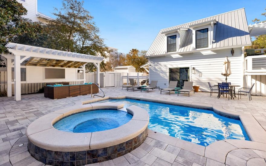What a great location centered in heart of Seagrove Beach!  The home offers treed privacy on the east side of the lot. It offers easy walking access to the Eastern Lake beach access where you will find white sand beaches and emerald green waters of the Gulf of Mexico.  The main home has 4 spacious bedrooms and 4 baths.  The carriage house offers 3 bedrooms, 3 baths and a full kitchen and living area.  There are multiple shaded porches for relaxing and just being lazy.   The size of the home makes it a very desirable rental for large multi-generational families.  You will enjoy the gorgeous pool and hot tub which is located between the main house and the guest house.   The carriage house has its own driveway and parking offering ample parking for all.  This information is deemed reliable but should be verified by the buyer.