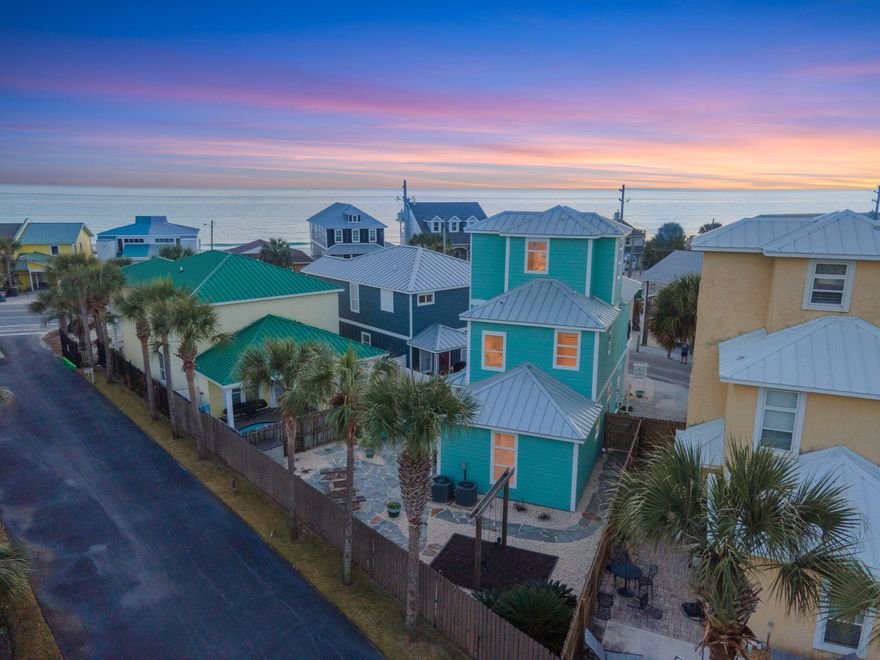 Located on the West end of Panama City Beach, this charming beach cottage is located just steps from the 94 beach access and offers beautiful Gulf views from the second and third floors. Stepping through the front door you're immediately welcomed into an open concept living, dining, and kitchen. With oversized windows surrounding the entire space, natural light spills in creating a warm environment for gathering. The kitchen features new stainless steel appliances and granite countertops. Off the kitchen, the first of three bedrooms is located on the first floor and features a walk-in closet and a full bath located just outside. Moving upstairs to the second level, the master suite is located on the South side of the home and features large windows and private balcony to soak in the Gulf