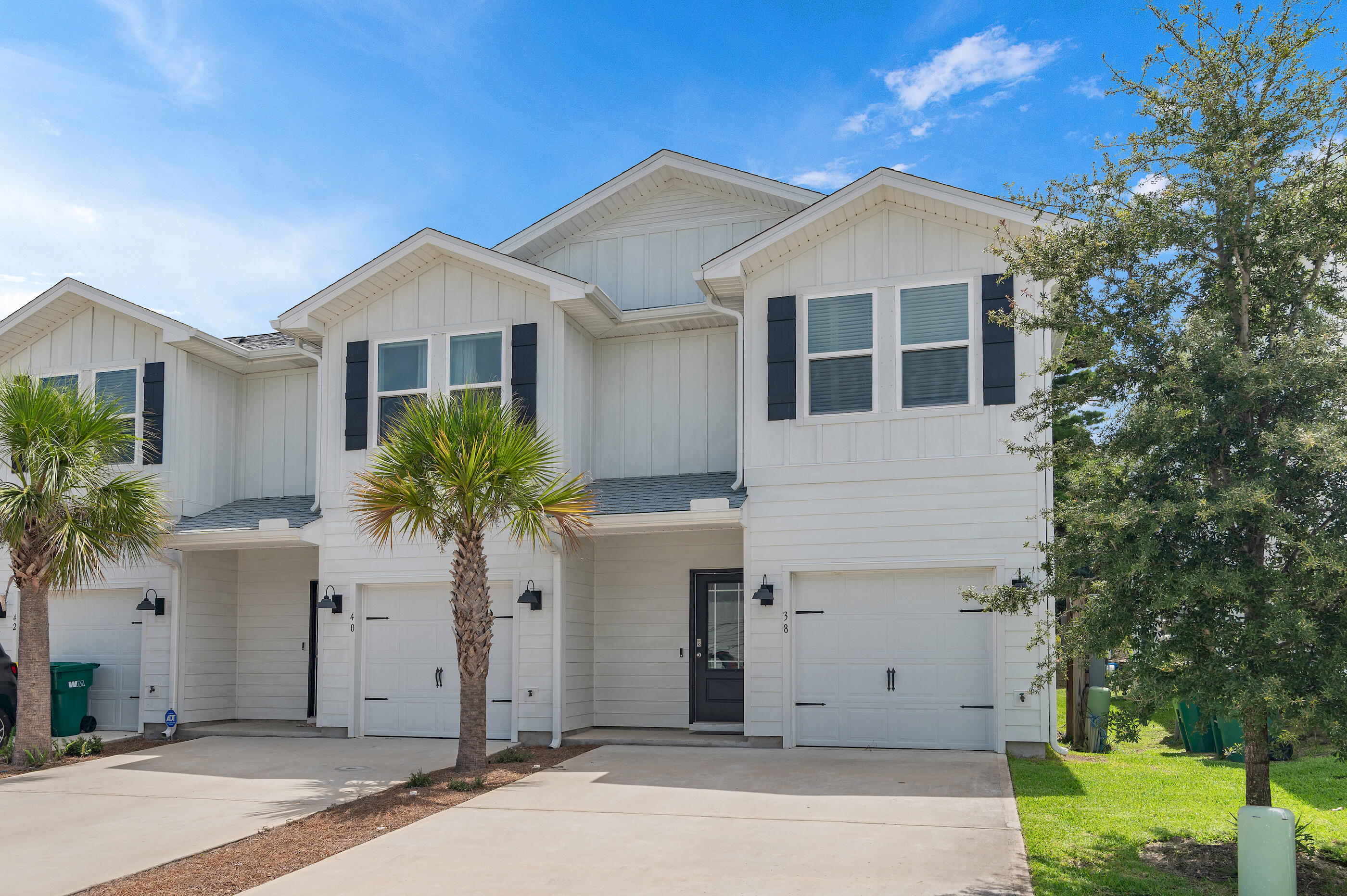 This end unit townhome features 3 bedrooms, 2.5 bathrooms, with a 1 car garage and a two car driveway. The backyard offers extra privacy with wooded views. All bedrooms are located on the second floor, leaving plenty of space on the main level for entertaining and relaxing. Beautiful interior features in this unit include bright white cabinetry in Ivory, quartz countertops, center island with farm style sink, stainless kitchen appliances which include a stove microwave and dishwasher. Living at Harbor Place Townhomes, you'll have easy access to nearby restaurants, shops, and plenty of entertainment options to include golf courses, water parks, the popular Crab Island, along with miles of white sandy beaches. This community is just 14 miles to both Eglin AFB and Hurlburt Field.