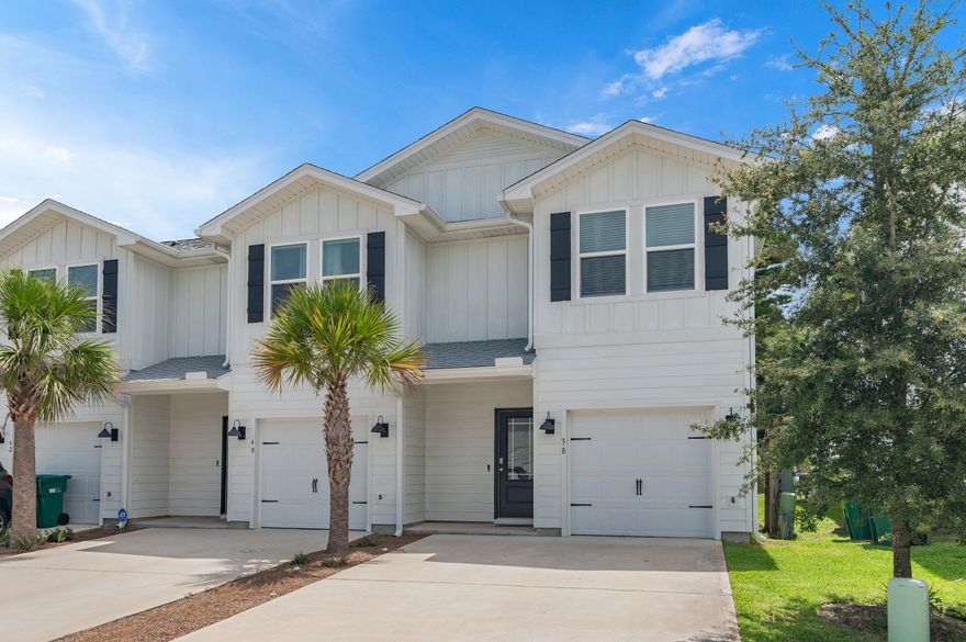 This end unit townhome features 3 bedrooms, 2.5 bathrooms, with a 1 car garage and a two car driveway. The backyard offers extra privacy with wooded views. All bedrooms are located on the second floor, leaving plenty of space on the main level for entertaining and relaxing. Beautiful interior features in this unit include bright white cabinetry in Ivory, quartz countertops, center island with farm style sink, stainless kitchen appliances which include a stove microwave and dishwasher. Living at Harbor Place Townhomes, you'll have easy access to nearby restaurants, shops, and plenty of entertainment options to include golf courses, water parks, the popular Crab Island, along with miles of white sandy beaches. This community is just 14 miles to both Eglin AFB and Hurlburt Field.