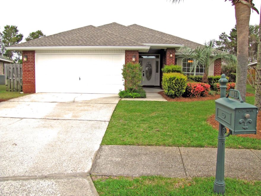 Live at the Beach! Bigger lot with 6 ft wood privacy fence. 4BR/2BA all brick home in gated neighborhood. All tile! No carpet.  Walk to our private beach access! Nice upgrades including granite, wine cooler, & stainless steel appliances. Huge kitchen open to the family room. High ceilings & plant shelves in the kitchen, dining room, & living room. Split bedroom plan with master on opposite side of house. Nice master suite with separate garden tub. Use one bedroom as an office at the front of the house. Formal dining room and huge eat in kitchen area. 2 car garage. Big lot with expansive stone paver deck, & pergola. Great for entertaining. Build a pool! Vacation Rentals gross $60k to $85k! New Roof Dec 2020.  Gas Hot Water Heater 2018.  Freshly Painted March 2021.  Looks and feels new!