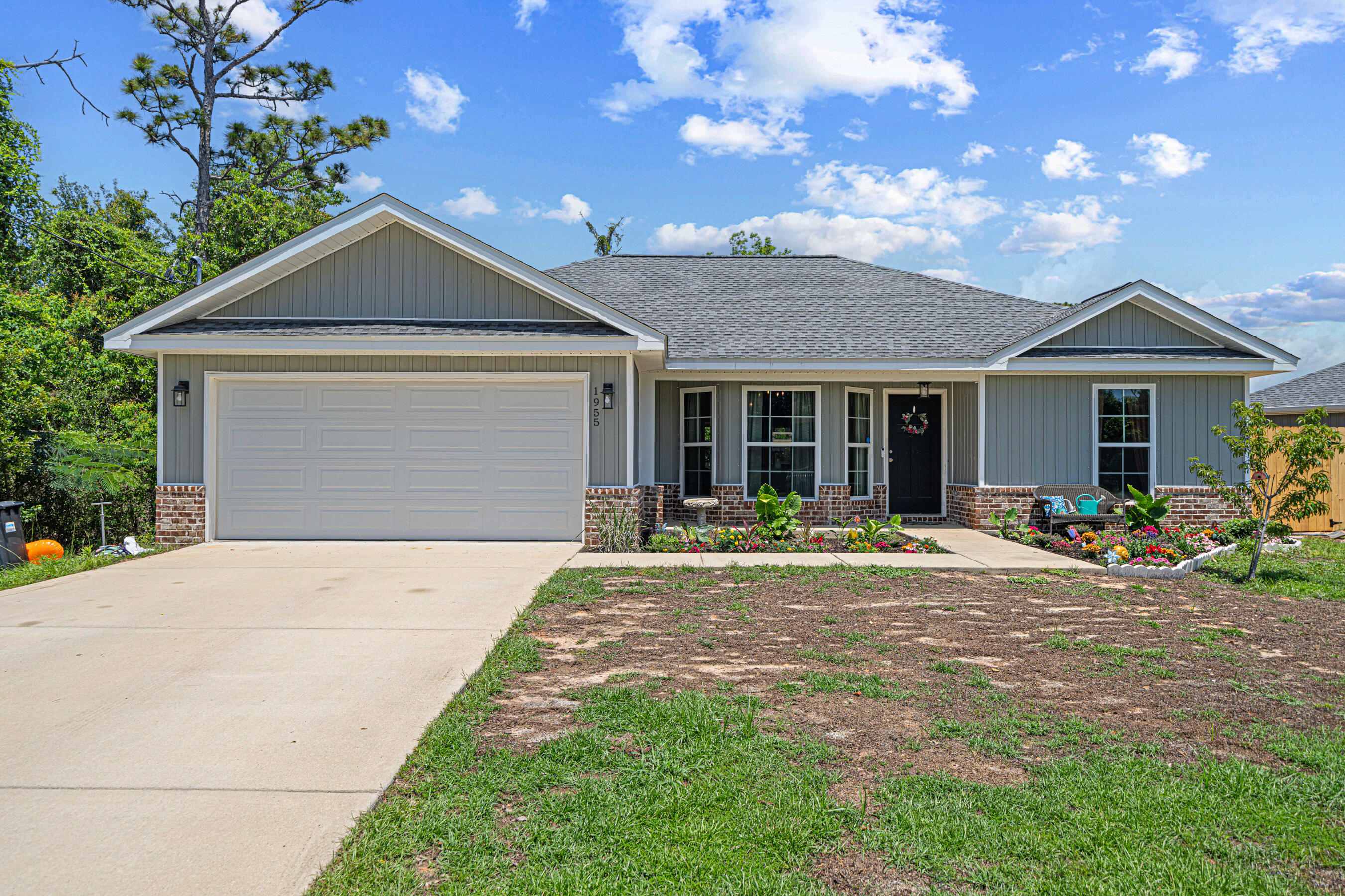 Welcome to 1955 Pentagon Street in Gulf Breeze! Built in 2020, this 3-bedroom, 2-bathroom home offers 1,428 square feet of well-designed living space. The open-concept floor plan connects the spacious living room, dining area, and kitchen--ideal for both everyday living and entertaining. Luxury vinyl plank flooring flows through the main living areas, offering durability and style, while plush carpet in the bedrooms adds comfort and warmth.The kitchen features modern appliances and ample cabinet space, making meal prep a breeze. The primary suite includes a private en-suite bath, and two additional bedrooms provide flexibility for guests, family, or a home office. Step outside to enjoy the newly added screened-in porch--perfect for relaxing evenings or morning coffee without the bugs. The backyard offers room to garden, play, or entertain, and the attached 2-car garage adds convenience and storage. Located just a short distance from schools, shopping, and the white-sand beaches of the Gulf Coast, this move-in ready home blends modern touches with everyday comfort.