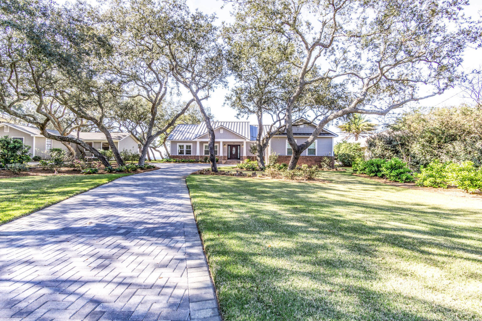 Truly stunning picturesque craftsman style home on 85 feet of waterfront in beautiful Destin, Florida. This home offers so much for any family wanting to experience true Florida living. Every material for the construction of this home was carefully selected and meticulously installed to ensure a perfect home. Even the beautiful hardwood floor was salvaged and re-purposed from a 100+ year-old home in Virginia. The wood beam detail on the cathedral style ceilings offer an added homey feel that compliments the wood paneled walls. A gourmet kitchen makes for a beautiful centerpiece to this open floor plan and there are plenty of windows and doors to let in that natural light and feel the breeze off the water.