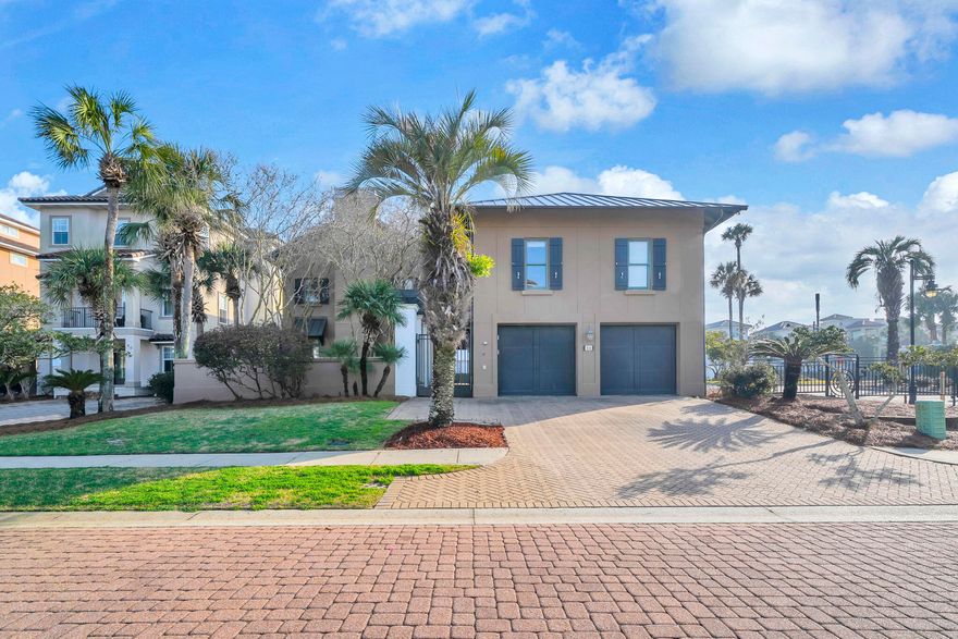 Welcome to your dream beach retreat in the highly sought-after, gated community of Destiny East sits This beautifully renovated villa sits on a corner lot which offers privacy and plenty room for everyone. Villa comfortably sleeps 20 and was designed with entertaining and luxury coastal living in mind. Short-term rentals ok! The main residence features five spacious bedrooms, including three primary suites with private ensuite baths, offering comfort and privacy for family and guests alike. A second-floor bunk room and an oversized third-floor bunk room with adjoining den and charming spiral staircase create the perfect gathering spaces for kids and guests. 
At the heart of the home, the huge gourmet eat-in kitchen impresses with a granite island, tile backsplash, and abundant space for hosting. Multiple living and entertaining areas flow seamlessly to the outdoors, where you'll find two enormous covered porches, lush landscaping, extensive outdoor lighting, and a private resort-style setting.
Step outside to your own backyard oasis featuring a heated private pool, hot tub, and expansive grilling area--perfect for relaxing after a day at the beach. Additional highlights include a full-house generator, on-demand water heater, new roof (2023), 2-car garage, and thoughtful upgrades throughout.
Above the garage is a separate apartment-detached carriage house provides additional flexibility--ideal for guests, in-laws, or rental potential. Carriage home is complete with a full kitchen, a living room and a separate bedroom.
Destiny East amenities include a deeded beach access, lagoon-style community pool, Destiny East Clubhouse,  tennis/pickleball courts, a putting green, playground, fitness center.  Close to several outstanding restaurants, and local attractions. This exceptional property offers the ultimate combination of location, luxury, and space--perfect as a primary residence, second home, or high-performing vacation rental in one of Destin's most desirable communities
