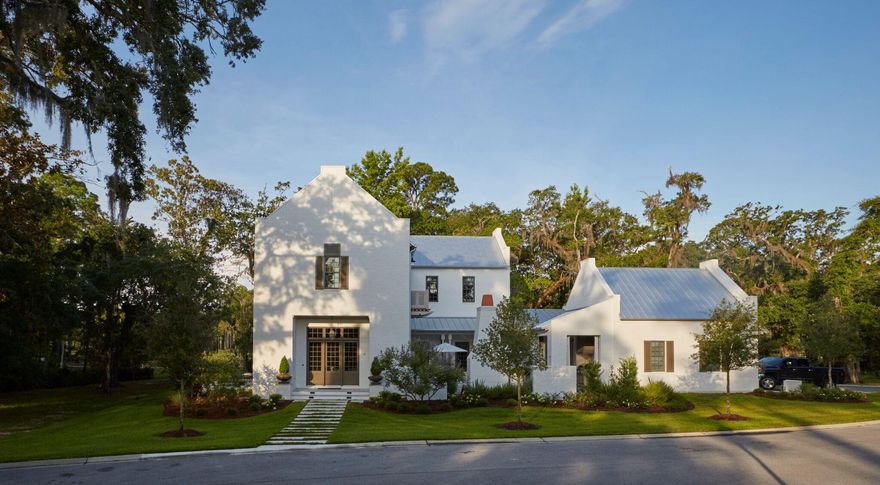 This incredible 4 bedroom, 4.5 bath custom residence in Churchill Oaks was designed by Savoie Architects. White painted brick exterior with parapet walls, open courtyard and outdoor living, open interior floor plan, and downstairs master suite all located on a premium corner lot with bay views. Churchill Oaks exudes charm, taste, and Southern spirit; the perfect place for families to gather, interact, and call home.