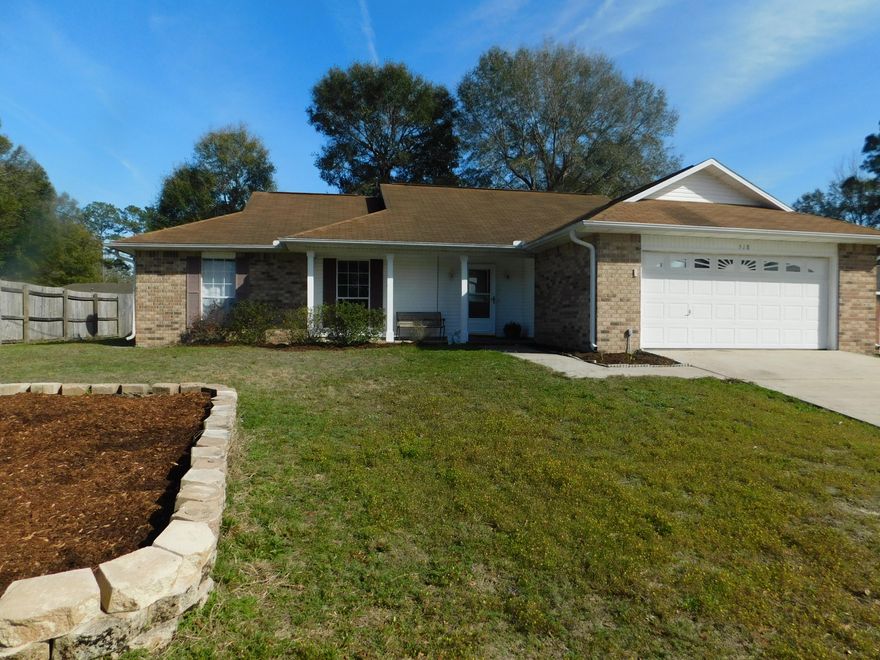 Spacious all brick home conveniently located close to schools, shopping and community events. You enter into the tiled entry way into a large living area with wood burning fireplace, laminate flooring, and elevated ceilings. Exit through a French door to a 12x22 ft screen room that will serve as a second living area for much of the year. Large privacy fenced yard provides space for entertaining and play.You can re-enter the home through sliding glass doors into the dining area and kitchen. Kitchen features granite counter tops, French door stainless refrigerator, breakfast bar and ample work space. It looks over the dining area so the cook can enjoy conversation with guests. Master bath has double vanities.