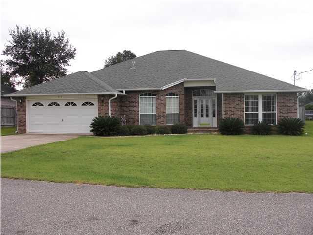 Beautiful home south of I-10, convenient to bases. Spacious split floor plan. Tile and hardwood through out. Screened porch. Master Bath has double vanities, separate shower and garden tub. Large Master bedroom.