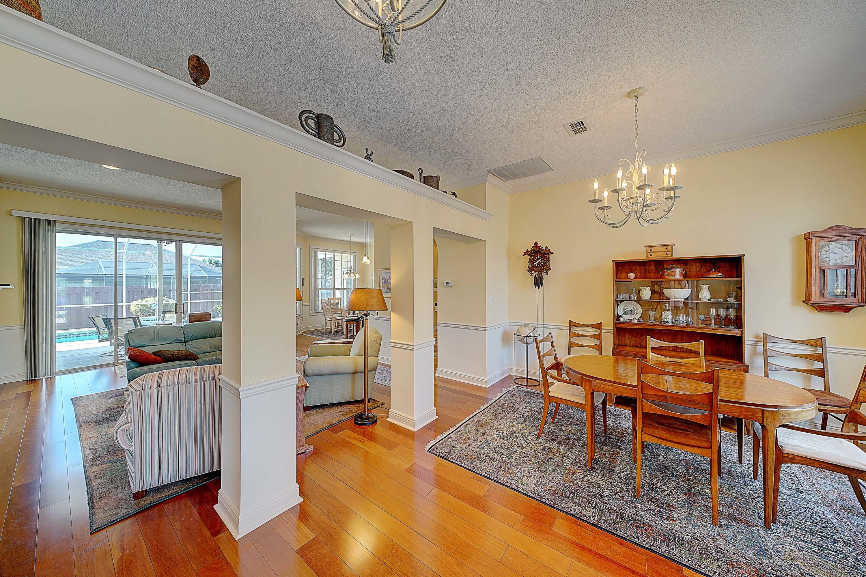 Boasting three bedrooms / two bathrooms in Summer Breeze and 2270+/- square feet on a corner lot.Absolutely stunning and meticulously maintained executive home within walking distance of the Gulf of Mexico. Pride of ownership is exhibited in every square foot of this home. Hardwood floors in main living areas, and carpet in the bedrooms. Several quiet seating areas with bay windows and an immaculate screened in pool with access from the master bedroom, and the living room.Summer Breeze Phase II homes are in high demand. Sidewalks to enjoy afternoon walks and bike rides with your children. Premium finishes. Newer roof. Two car garage.