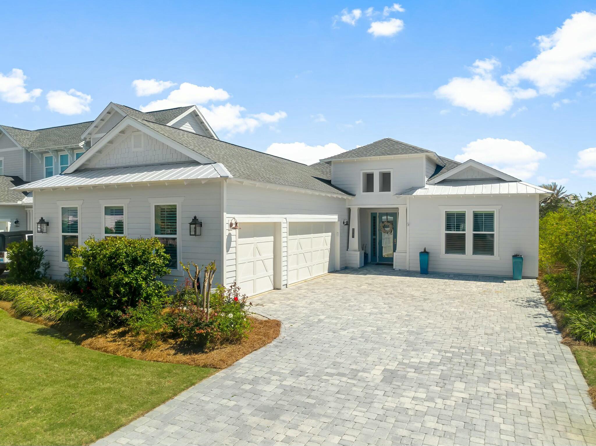 Located in the exclusive gated community of Watersound Naturewalk, this beautifully upgraded single-level home offers luxurious living with 10-foot ceilings, hardwood floors, shiplap accent walls, and custom finishes throughout. The open-concept design features a gourmet kitchen with a gas stovetop, wine fridge, oversized island, and pantry, flowing seamlessly into the spacious living area.Enjoy the outdoors in your private porch with automatic privacy screens, heated saltwater pool, spa, and firepit -- the perfect spot for grilling, relaxing, or watching a game. The primary suite includes a large ensuite with a walk-in shower, soaking tub, and direct access to the pool. Two additional guest rooms, one with an ensuite, provide ample space for family or visitors. The fourth bedroom is currently used as a home office.
Other highlights include custom window treatments, a 3-car garage with attic storage, and a bright laundry room with ample storage. All rooms come with televisions for added convenience.
Enjoy access to golf, pickleball, tennis, community gym, and nature paths within the community. A short bike ride to Alys Beach and Rosemary Beach, with shops, restaurants, and a farmers market nearby.