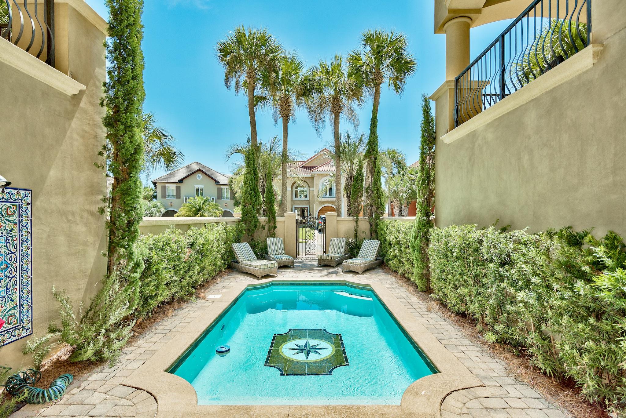 The stunning ''Casa De Palms'' is a Mediterranean masterpiece located across from the sugar white sand beaches of the Gulf of Mexico and located in Avalon Beach Estates. If you've been looking for a one of a kind piece of construction in a great location, look no more! This stunning home offers 5 bedrooms, 5.5 baths, an elevator, a courtyard at the entrance with a private pool, breathtaking stonework, and direct private beach access. Not only is this home a masterpiece structurally, the furnishings step out of the highest end interior design magazines! Casa De Palms welcomes you with a stone staircase surrounded by columns and travertine floors. The first floor has two large bedrooms, one being a bunk room and a very large laundry room with convenient morning kitchen. The main living space and gourmet kitchen are located on the second floor, with spacious balconies off each room. Every room and each balcony is equipped with the highest quality furnishings, upgraded electronics, and high end appliances. With each bedroom a large bathroom suite offers double sinks, garden jet tubs, stone showers and walk in closets. This home has too many features to mention and only a private tour will fully exhibit the care that has been put into this beautiful property. if you've dreamed of owning a home steps from the Gulf, in a gorgeous community complete with tennis courts and a club house, this is the perfect primary, secondary or investment paradise for you!. Schedule your tour today!