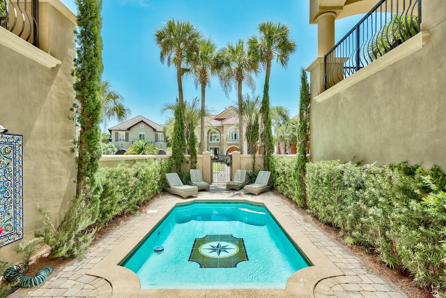 The stunning ''Casa De Palms'' is a Mediterranean masterpiece located across from the sugar white sand beaches of the Gulf of Mexico and located in Avalon Beach Estates. If you've been looking for a one of a kind piece of construction in a great location, look no more! This stunning home offers 5 bedrooms, 5.5 baths, an elevator, a courtyard at the entrance with a private pool, breathtaking stonework, and direct private beach access. Not only is this home a masterpiece structurally, the furnishings step out of the highest end interior design magazines! Casa De Palms welcomes you with a stone staircase surrounded by columns and travertine floors. The first floor has two large bedrooms, one being a bunk room and a very large laundry room with convenient morning kitchen. The main living space and gourmet kitchen are located on the second floor, with spacious balconies off each room.  Every room and each balcony is equipped with the highest quality furnishings, upgraded electronics, and high end appliances.  With each bedroom a large bathroom suite offers double sinks, garden jet tubs, stone showers and walk in closets.  This home has too many features to mention and only a private tour will fully exhibit the care that has been put into this beautiful property.  if you've dreamed of owning a home steps from the Gulf, in a gorgeous community complete with tennis courts and a club house, this is the perfect primary, secondary or investment paradise for you!.  Schedule your tour today!  