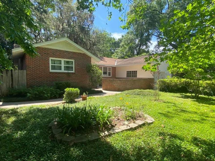 This home is a MUST SEE! 5 bed / 2 bath home with fully fenced low maintenance yard, mature trees and professional looking landscaping in the front and back. The front of the home features a large stone paver patio with ample room for entertaining. Freshly painted interior and beautiful hardwood flooring in many areas of the home. A large picture window brings in soft natural light into the front room. The dine-in kitchen offers the flexibility of using the front room as an additional dining area or second family room. Bedrooms feature hardwood floors and ceiling fans for extra comfort. The largest of the five bedrooms has new carpet and built in bookshelves. The family room has sliding glass doors that lead to beautiful landscaped and well shaded backyard. Gas water heater and water softener system are one year old, copper wiring, newer windows in some of the bedrooms, updated guest bathroom. Zoned for highly sought after Niceville schools and convenient to parks and boat launch --  this home is in a great location! Schedule a showing for this one of a kind home today!