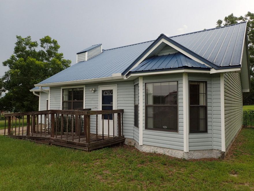 This REO home rests right on a full acre of level, cleared, fenced land. Located in North Crestview, but only mins from Schools, businesses and churches, this 2 bed 1 bath is both unique and worth a quick look. Built in 1986, this home has vaulted ceilings, fireplace, laminate and tiled floors as well as carpets in bedrooms. Home is nearly 1300 SF but due to conditions may not qualify for all types of financing. Call today to view this home~ Property being sold subject to HUD Guidelines 24 CFR 206.125.