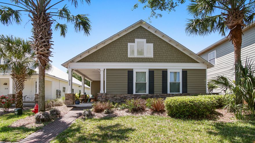 This thoughtfully designed home in Turtle Cove blends quality construction with a coastal craftsman style, all just minutes from the beach and Lake Powell. Inside, you'll find an open-concept layout with a split-bedroom floor plan that offers privacy and space for everyone. The main living areas feature tile flooring, while the bedrooms have beautiful wood floors and crown molding adds a polished touch. The kitchen is both stylish and functional, with granite countertops, custom cabinetry, and a layout that flows seamlessly into the living space--perfect for everyday living or entertaining. The spacious primary suite includes a large en-suite with double vanities, a tiled walk-in shower, and a separate soaking tub. Every bedroom has oversized closets for extra storage The home is equipped with a tankless water heater for added efficiency. Outside, enjoy your morning coffee on the covered front porch or relax under the pergola out back. There's a single-car garage, additional rear parking, and extra space in the front for guests. This home sits on one of the most sought-after streets in Turtle Cove, directly across from the community park and within walking distance to the clubhouse, fitness center, and pool. Turtle Cove offers residents access to Lake Powell, one of the largest coastal dune lakes in the world, along with community amenities like a dock, tennis courts, and more. Plus, you're just under 2 miles from the beach and close to Camp Helen State Park for even more outdoor fun.