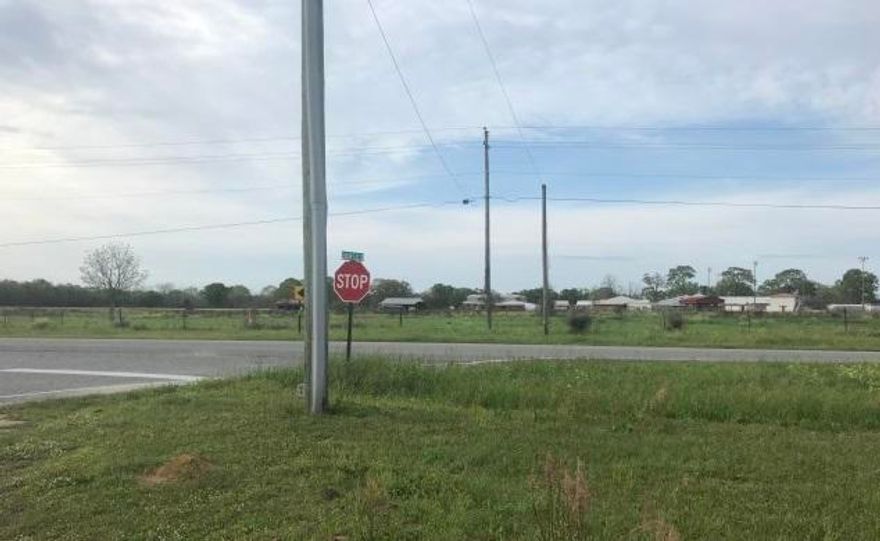 Corner lot in city limits of Paxton located close to 331 next to Ellis Agricultural Field Airport. The property is a great opportunity for growth in the area open to all possibilities with commercial, residential, storage, trucking, 5 miles to Lake Jackson and only minutes to the highest elevation point in Florida Britton Hill. 1 hour from the South Walton Beaches. Great school district. This commercial property consist of a brick building on the corner and work building located directly south of the home. The current zone is 1 acre commercial and over 6 acres residential with a combined lot under one parcel ID. The town is happy to welcome new businesses and potential for this location to rezone to all commercial with this unique opportunity on a corner lot with frontage on Highway 147.