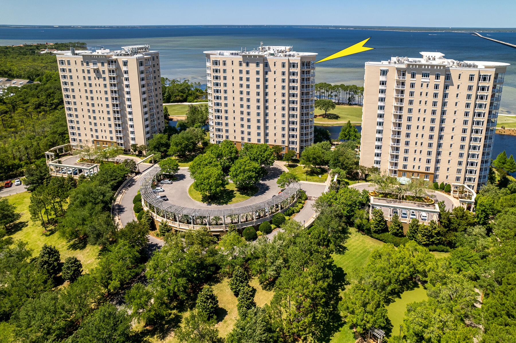 LUXURIOUSLY RENOVATED PENTHOUSE! Savor a stunning bird's eye view of the beauty of the Emerald Coast from this gorgeous One Water Place penthouse. Its desirable Castleton floorplan, featuring 3 bedrooms plus a large home office and wrap-around balcony, is enhanced by the 12' ceilings and greater privacy afforded by its top-floor location. The residence is excellently situated to enjoy views of the Gulf of Mexico, Choctawhatchee Bay, Fred Couples Signature Golf Course, and the abundant natural preserve land in Kelly Plantation. As befits the amazing natural setting, the interior exhibits artistic flair and grandeur, combined with attention to quality and convenience. The floors are 18x18'' Turkish polished marble. Custom carved marble fireplace... provide a focal point in the living room and master bedroom, while intricately carved columns embellish the formal dining room. Finish carpentry includes woodwork and solid core doors from E.F. San Juan, 11" baseboards, crown molding, chair rail and picture molding throughout, tray ceilings in the guest bedrooms, and a coffered ceiling in the office. Enhancing the architectural details, the lighting includes crystal fixtures in most rooms and rope accent lighting in the foyer, gallery, and primary areas, and dimmers on all ceiling light fixtures. The cabinetry is particularly notable, with custom pieces in the office and master hall, kitchen cabinets that extend to the ceiling, and exquisite Maitland Smith and Edgar Berebi crystal hardware. Highlights of the incredible kitchen include, but are not limited to, a huge island with 105" solid-piece granite breakfast bar; DCS 48" dual energy professional double oven and cooktop with 5 burners and griddle; a DCS warming drawer and microwave; Subzero fridge/freezer; Thermador dishwasher; 25-bottle dual-temp wine cooler; Manitowac ice maker; 44" chef's sink with double Koehler faucets; hammered stainless steel bar sink; pot filler; and more. Authentic mother-of-pearl backsplash and delightful fish drawer/cabinet pulls add a special shimmer. Condo living doesn't have to mean no grilling, especially with this patio kitchen. It includes a 36" Bull grill, a sink, cabinets with electrical power, travertine tile, and custom lighting. Many additional upgrades have been made beyond the standard level of One Water Place luxury, such as the surround sound, and a camera/recorder in the foyer. Conditioned storage space located in the parking garage conveys as well. This property is being offered with an assigned golf cart space, thus allowing you convenient enjoyment of One Water Place and Kelly Plantation's abundant amenities, as well as Florida's beautiful Emerald Coast!