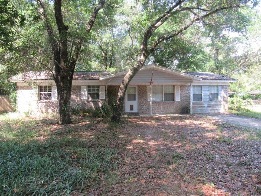 Great location. Quiet area. Needs a lot of work inside and out. Garage was converted to additional living space. DON'T WAIT...YOU'LL BE TOOO LATE!!!