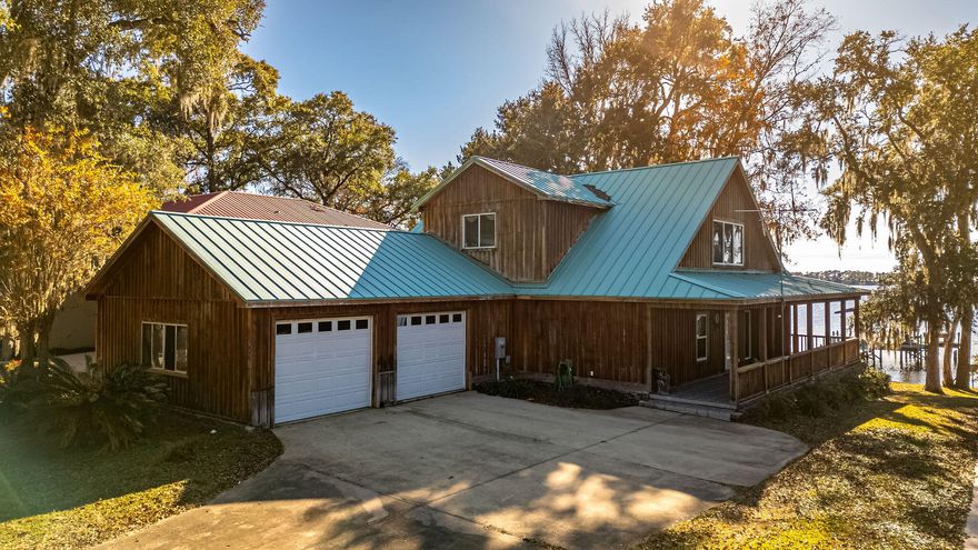 Embrace waterfront living at its finest in Freeport on Alaqua Bayou.  A private boat dock beckons water adventures, while the back porch offers a front-row seat to breathtaking views.Crafted with love & featuring cypress wood siding, this custom-built haven boasts an open layout that seamlessly connects living, dining, & kitchen spaces.  The primary suite on the 2nd floor, with its patio overlooking the bayou, creates a personal oasis for relaxation.  2 bedrooms with ensuite bathroom downstairs offers comfort.  Home features gas fireplaces, abundant storage, ensuring a clutter-free haven & laundry room with wash sink.  Tucked away on a tranquil cul-de-sac, this residence offers privacy & serenity.  Ready to live the waterfront dream?  Schedule your showing today!