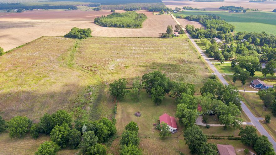 This Custom built home, situated on a picturesque landscape is a must see for the discriminating buyer. This one owner home has been well maintained, has a prideof ownership and many awesome custom features. The kitchen has gorgeous Kraft Made cabinets, granite counters and high end appliances. The island has electric outlets for convenience and the drawer below the oven can be used as a warming drawer. The beautiful wood floors in this home are oak. The walk-in closet in the master bath is a safe room with 3/4'' plywood on the walls and ceiling and is bolted to the foundation. Surround sound system can be heard on the back patio. The 36x14 upstairs loft is versatile and can be used as a game room or an extra bedroom. There is an amazing 40x60 shop, with roll up door for the RV and boat